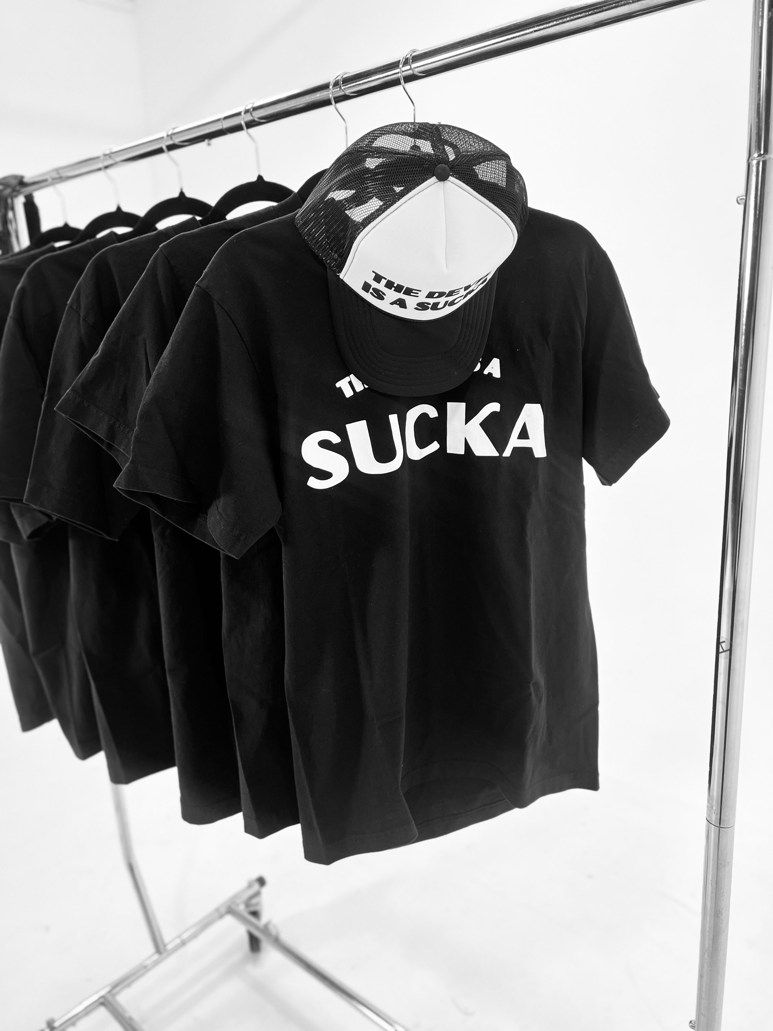 TDIAS_shirtandhatonrack.jpeg