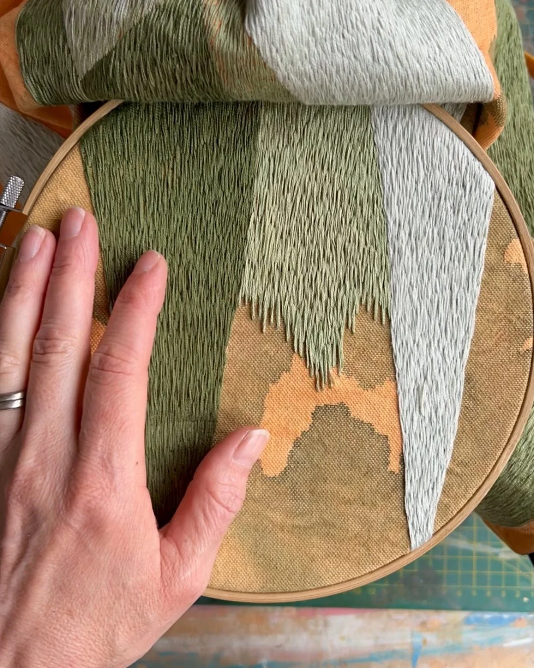 orange and green thread hand.jpg