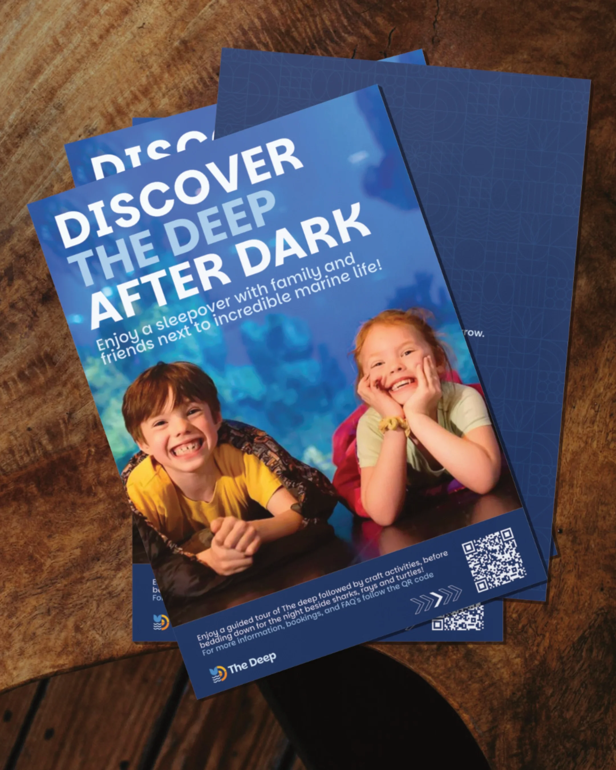 Flyer promoting a sleepover at The Deep with children smiling, with text about discovering the deep after dark and enjoying activities with family and friends, featuring a QR code.