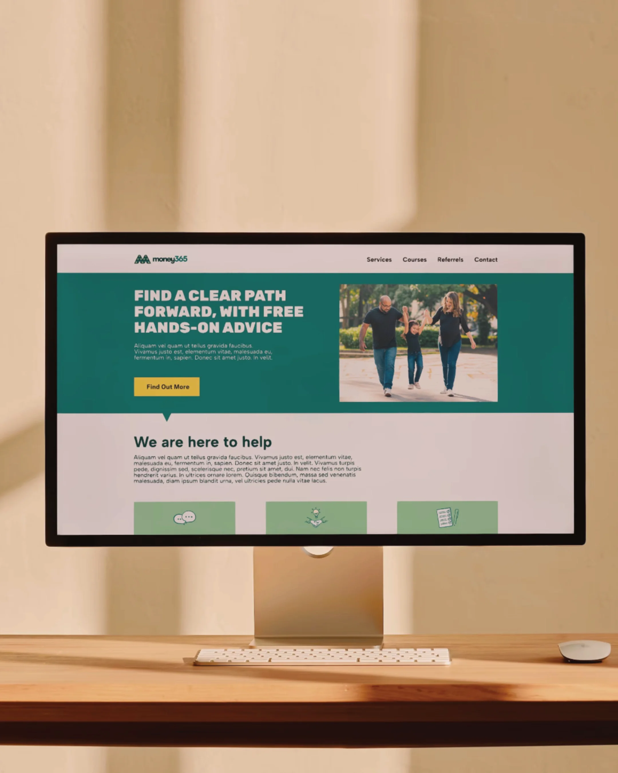 Computer monitor displaying a website for financial guidance, featuring a family walking outdoors and various icons about help and advice.