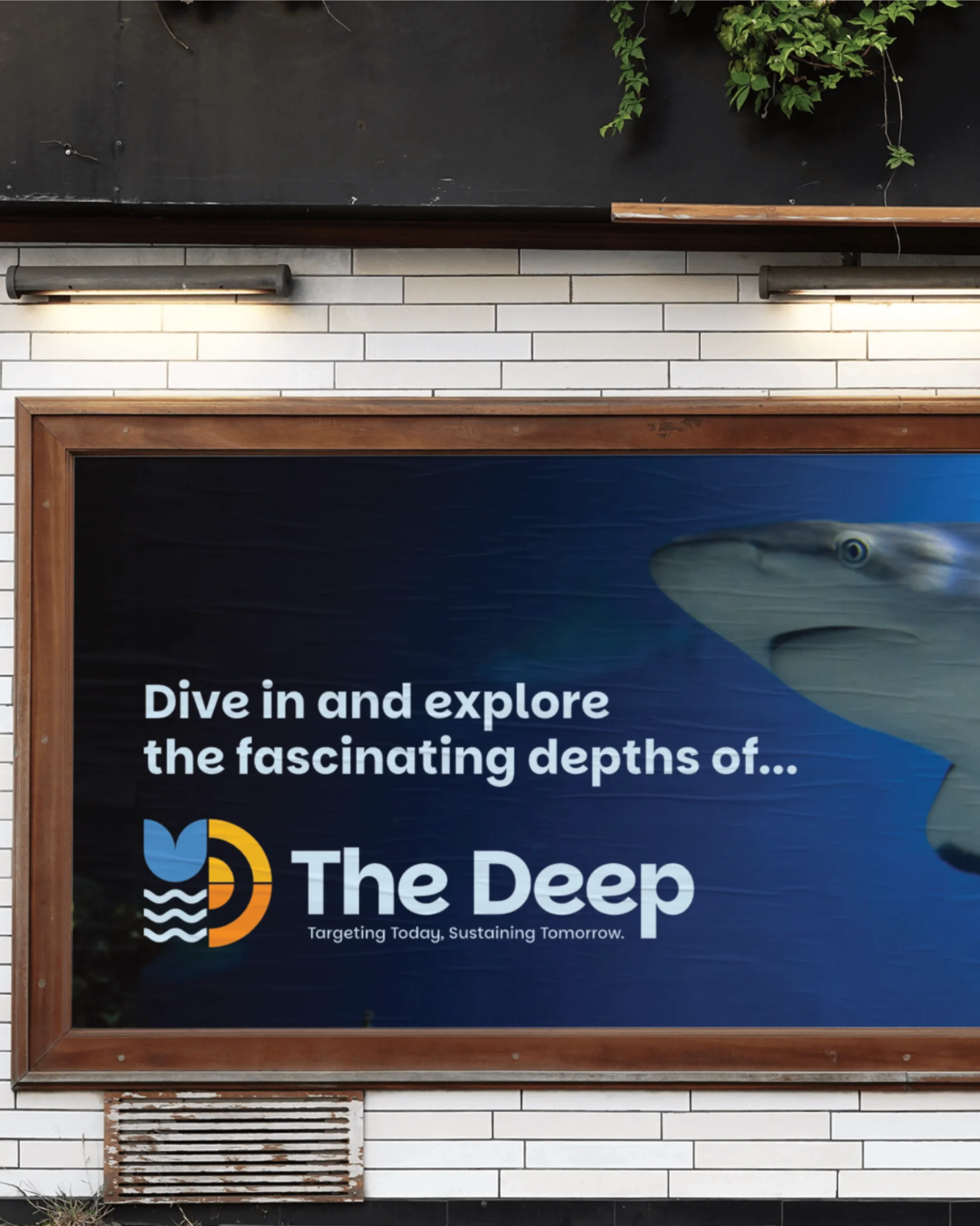 Sign advertising exploring the depths of the ocean, with a logo and slogan related to ocean conservation or research.