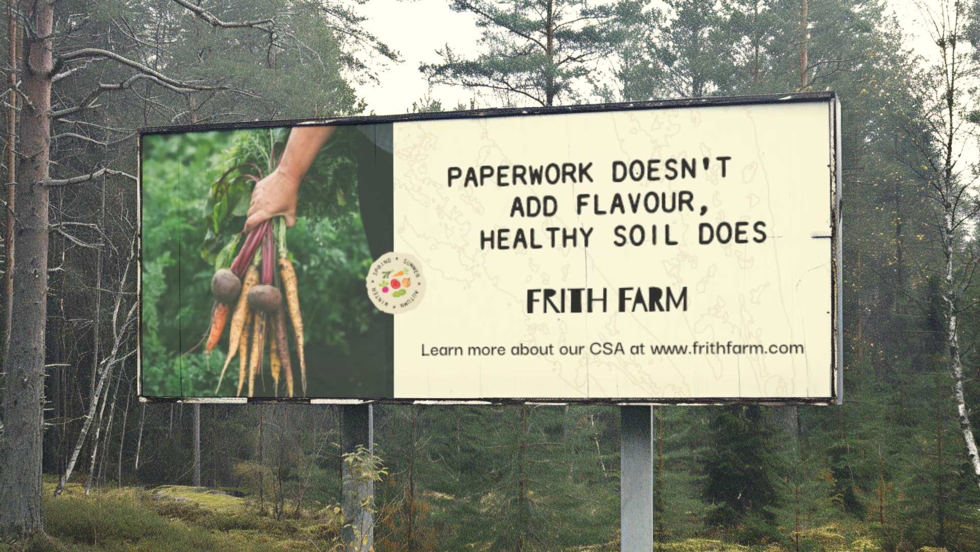 Billboard promoting Frith Farm, featuring a photo of a person holding freshly harvested carrots and a message about healthy soil benefiting farming, with website information at the bottom.