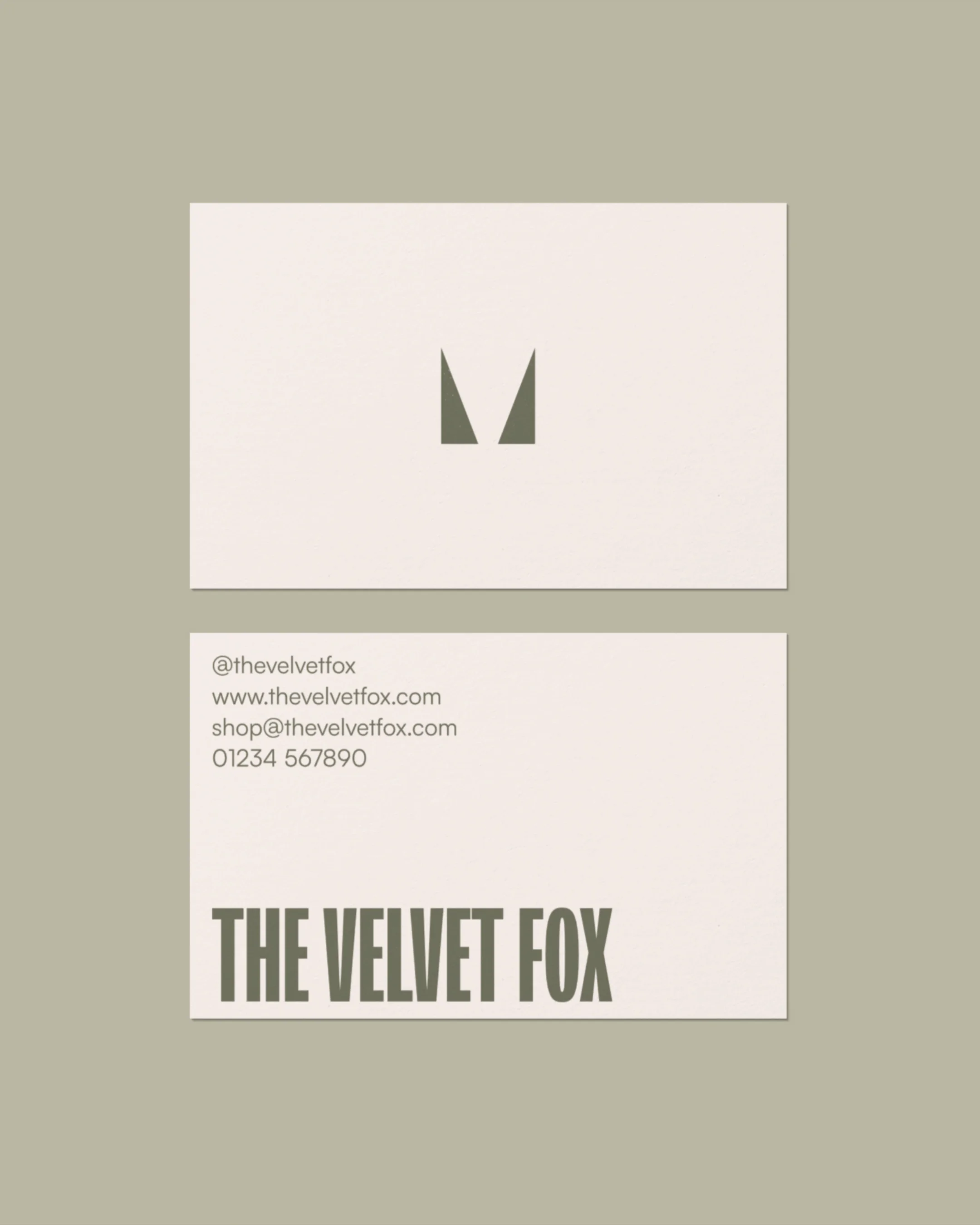 Business card for The Velvet Fox featuring a minimalist logo, contact information, and the company name in bold letters.