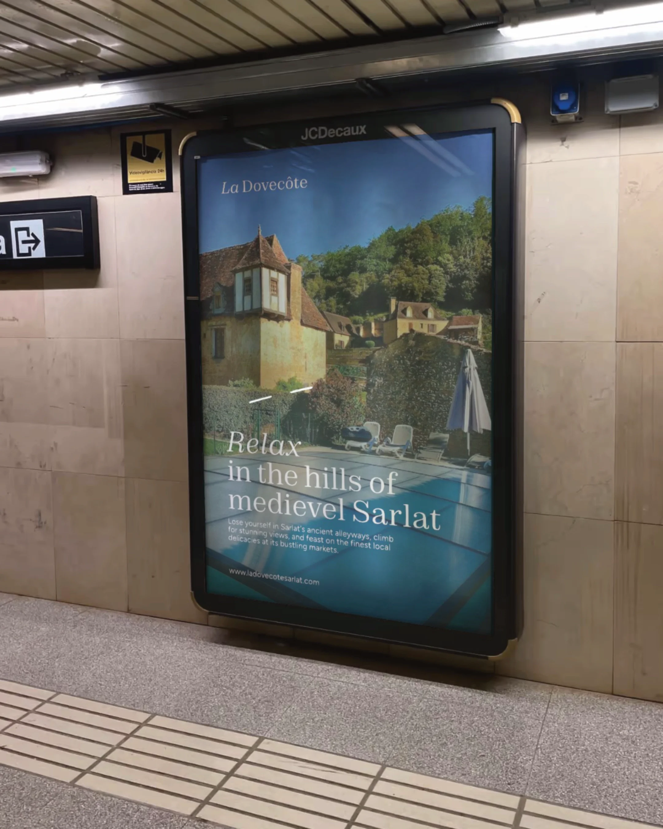 Digital advertisement for La Dovecôte promoting relaxation in the hills of medieval Sarlat, featuring a historic house, green trees, and a swimming pool with lounge chairs.