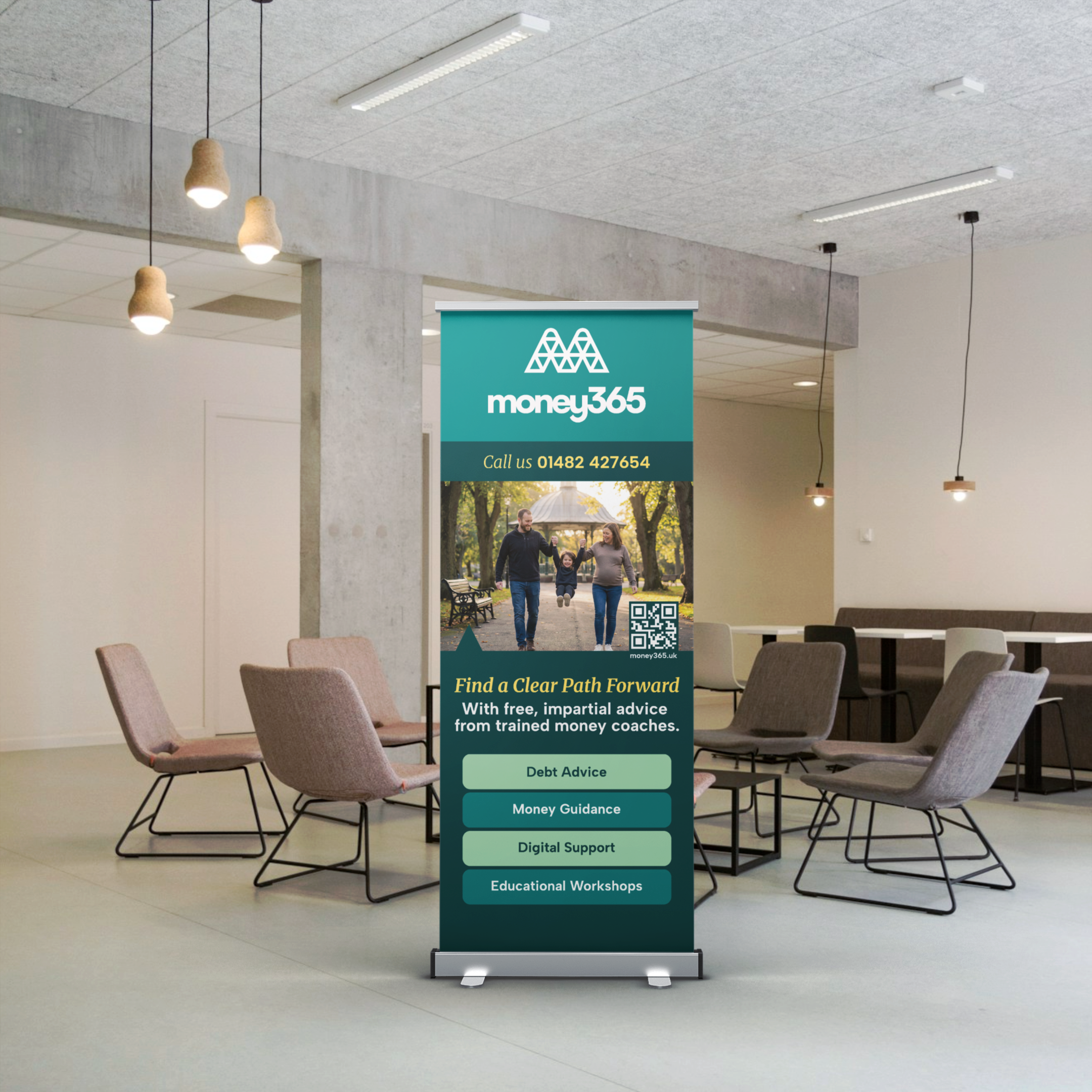 Money365 branded roller banner positioned in an office environment with matching chairs