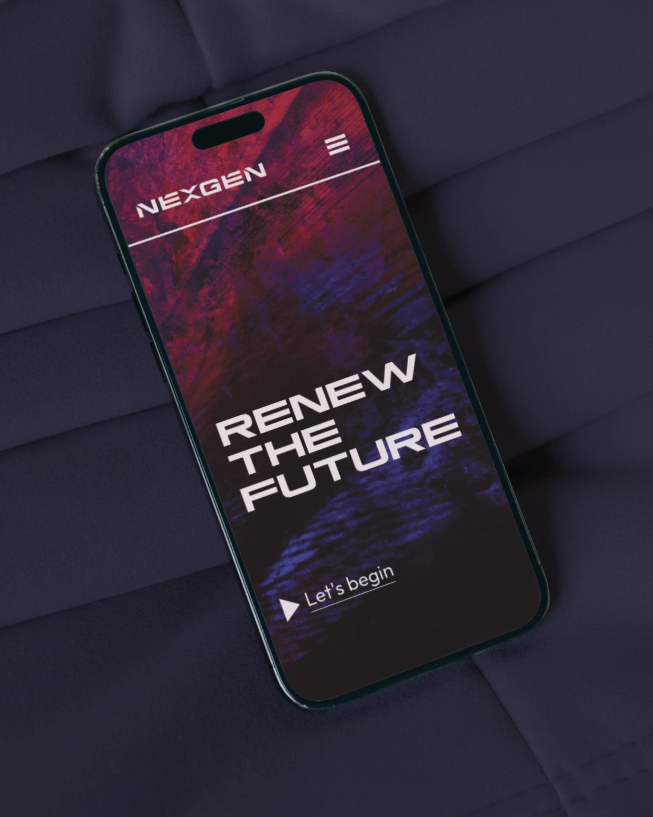 Smartphone displaying a screen with the text 'Renew the Future' and a 'Let's begin' button, resting on a dark padded surface.