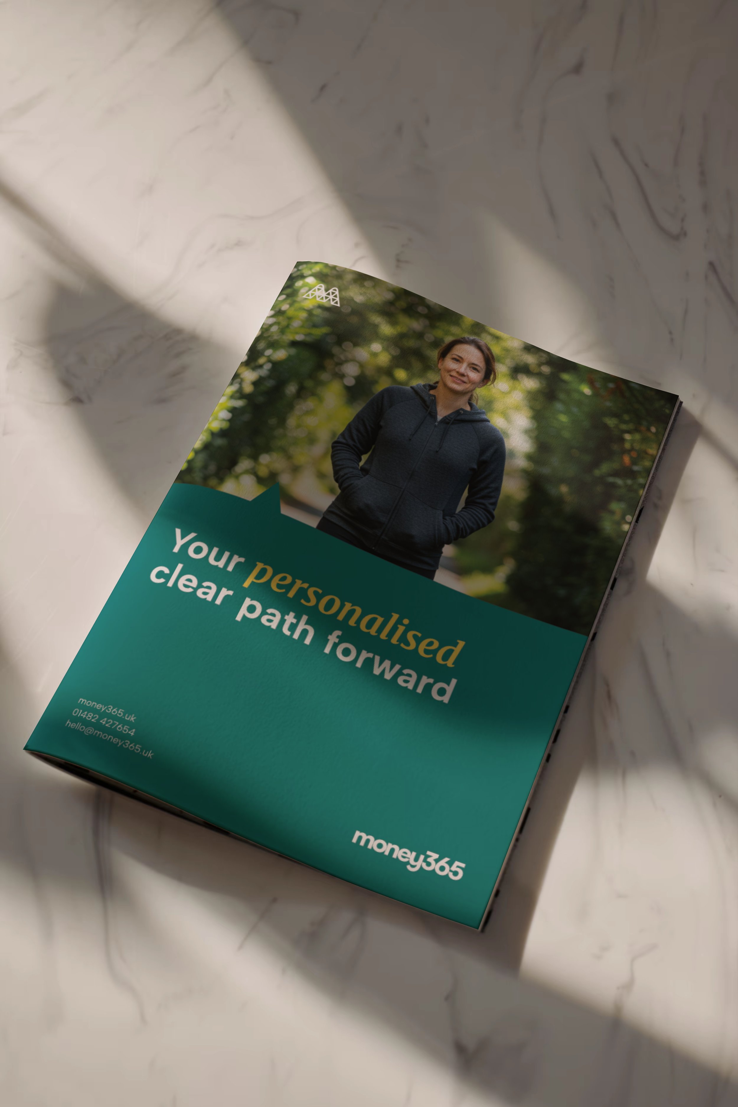 Money365 booklet positioned on a marble worktop