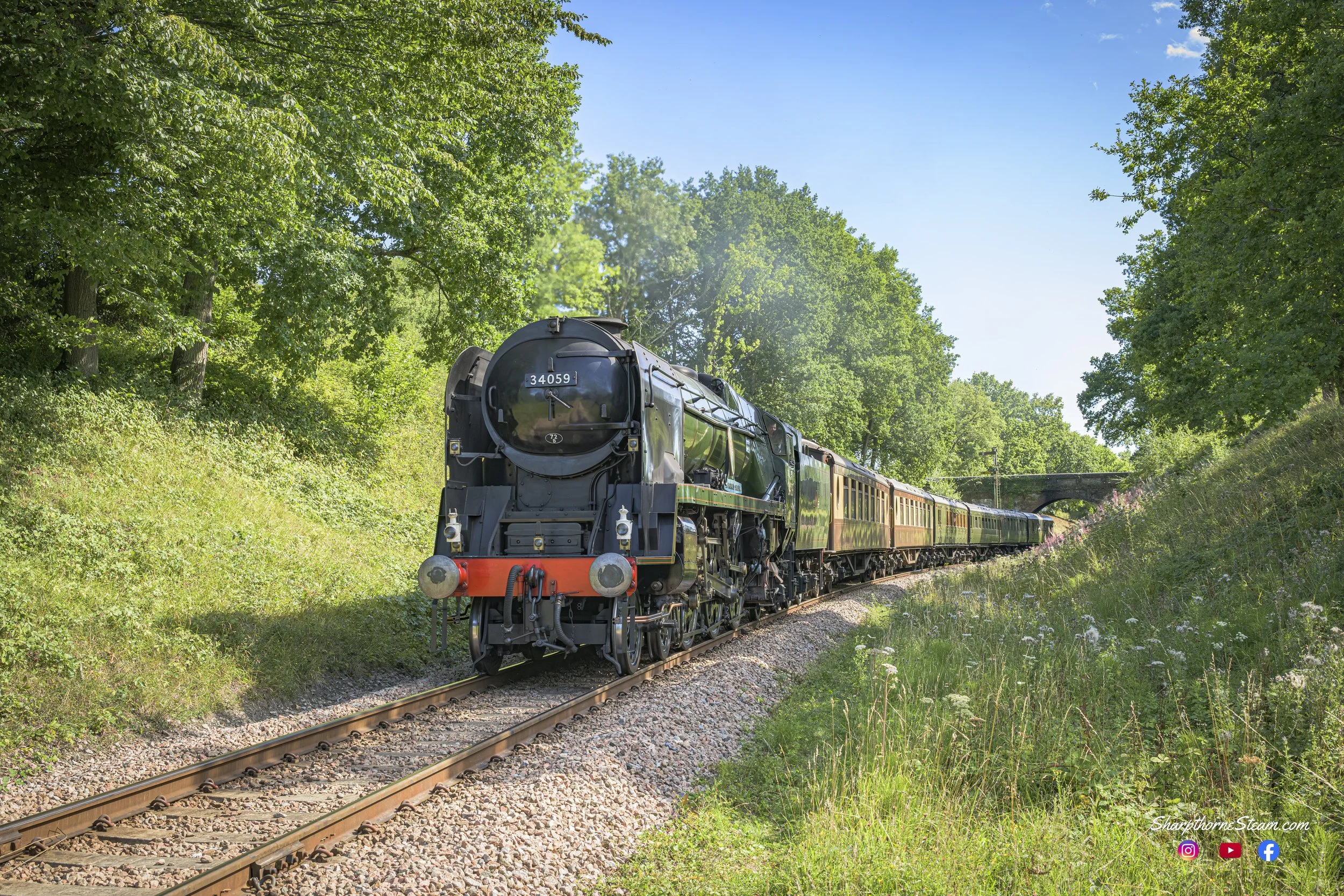 The Basking Bulleid - No34059 "Sir Archibald Sinclair" makes her way to Vaux End Bridge with an East Grinstead bound service during the 65th anniversary celebrations (Aug'25)