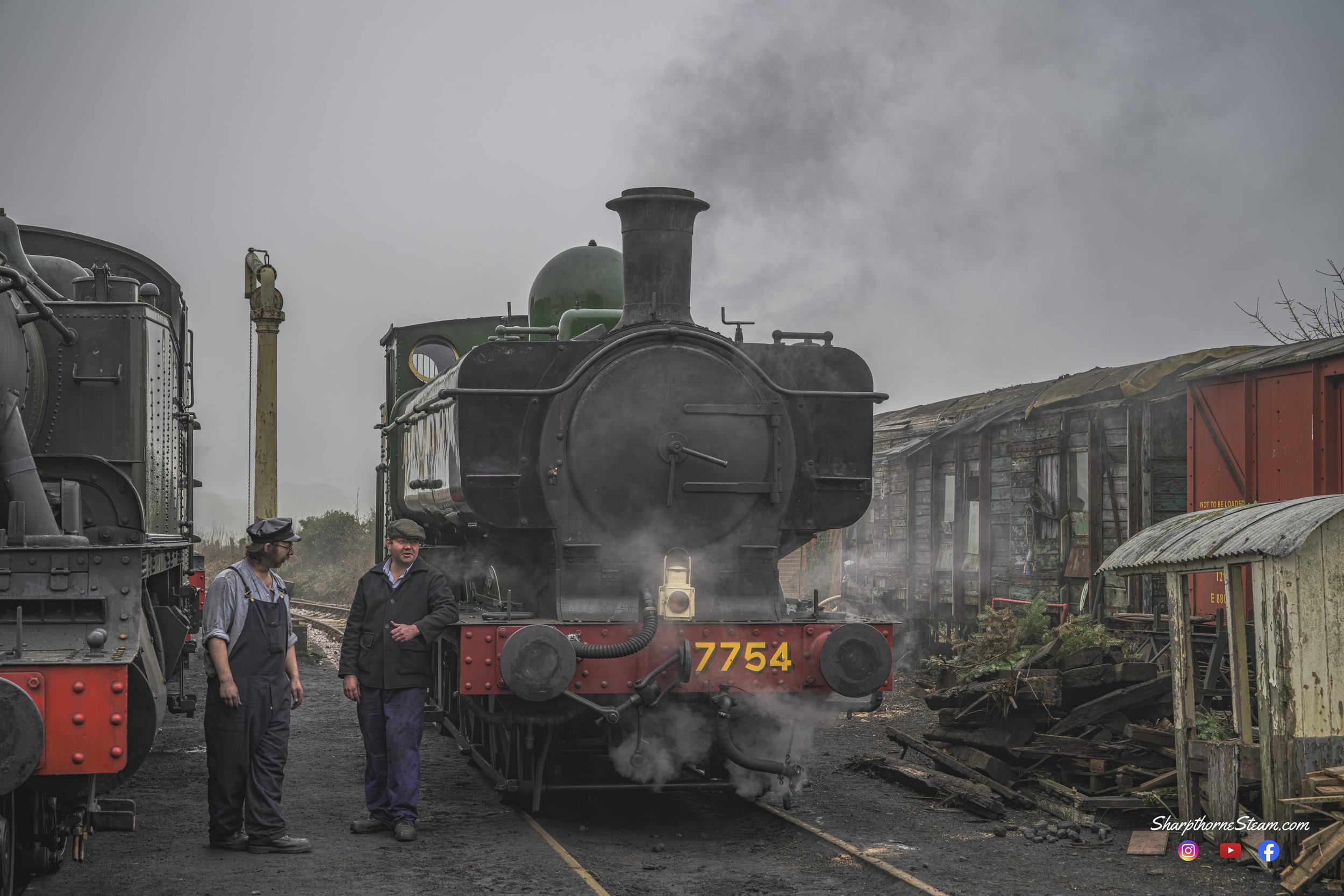 Talking Shop - No7754's crew is seen having a quick word after stabling No7754