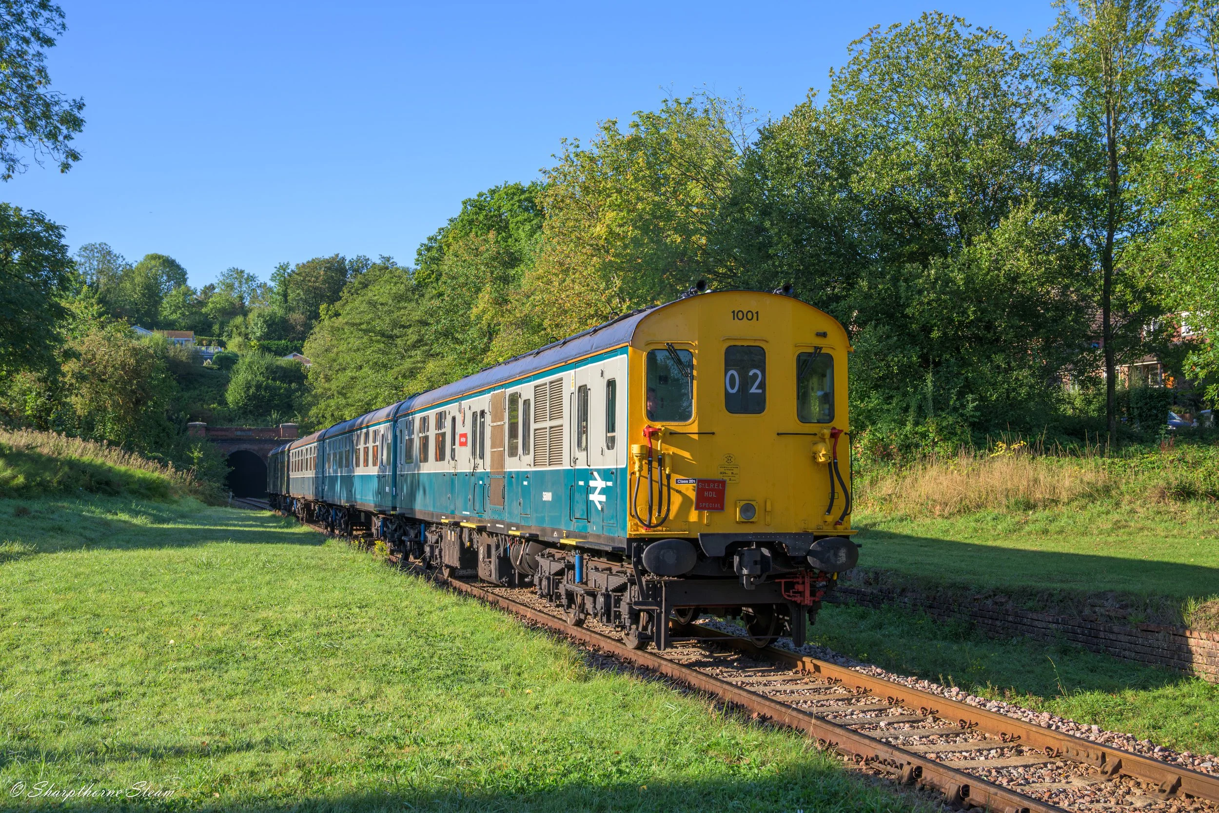 The Morning Thump - No1001 "Hastings" bathed in morning sunshine passes through Sharpthorne with the first up train of the Diesel Gala.