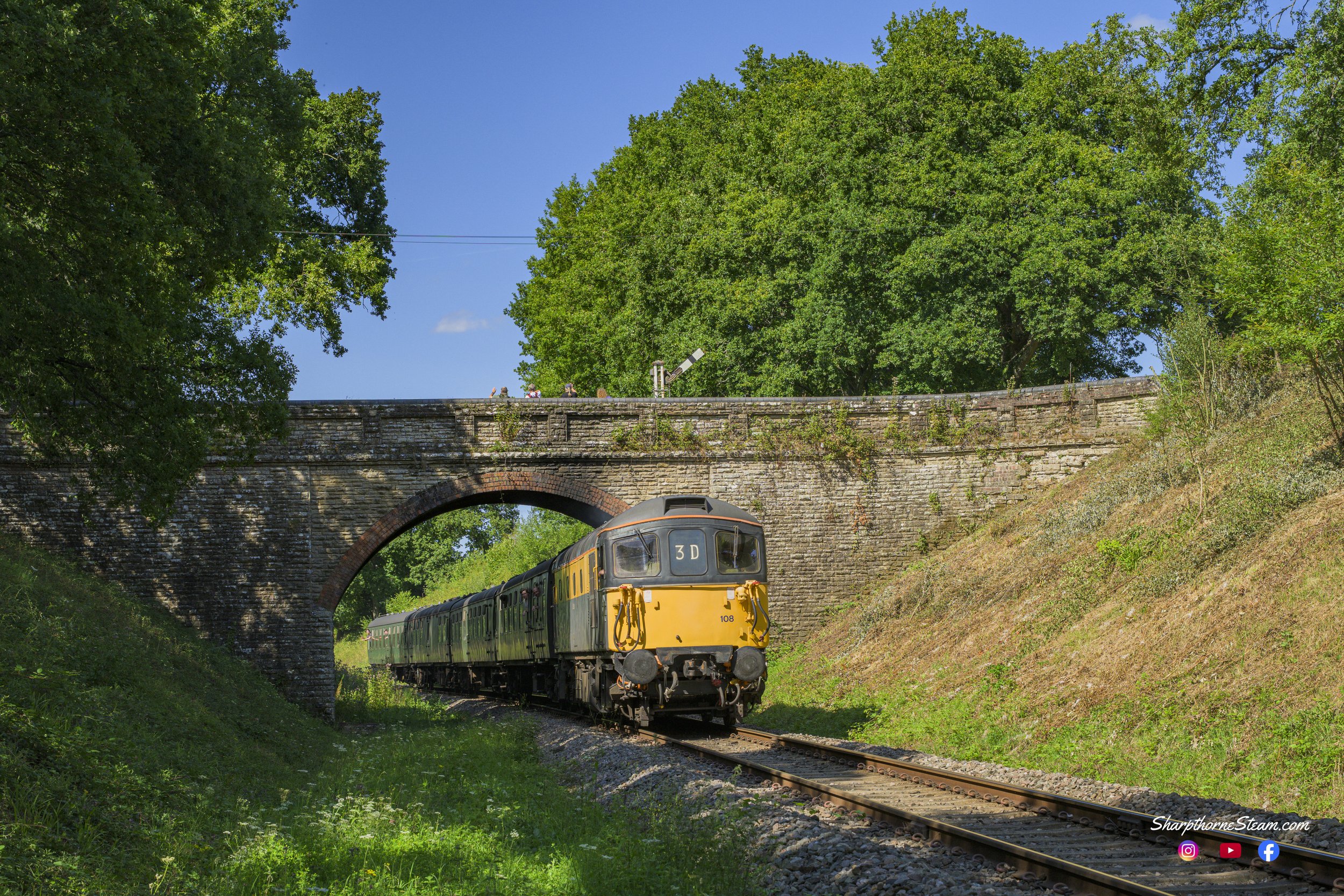 Visiting Crompton - No33108 was on loan for the summer to the railway and hauled services over the 65th anniversary weekend. Seen returning south to Horsted Keynes at Horsted Keynes Farm Bridge (Aug'25)