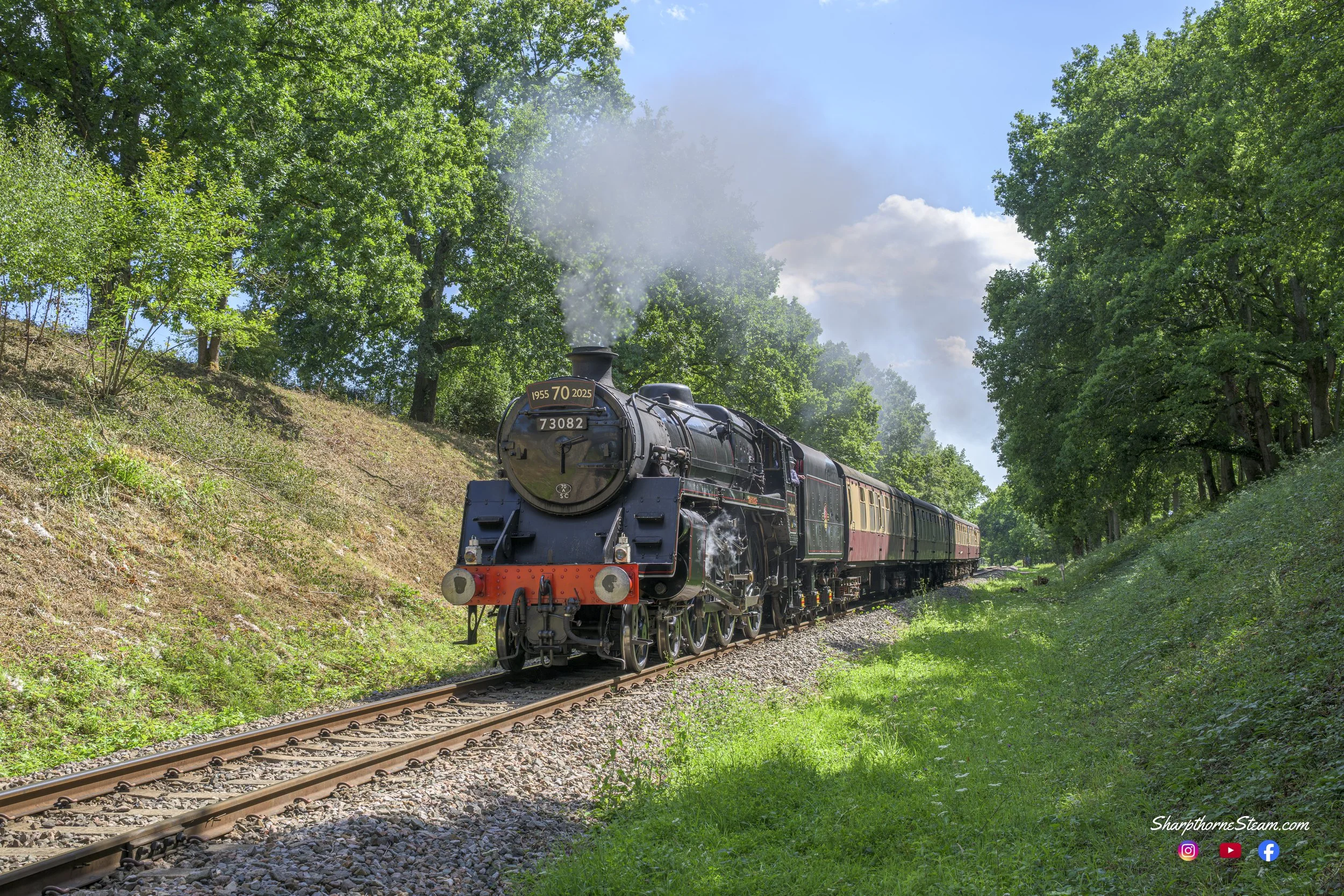 70 Years Strong - No73082 "Camelot" celebrated her 70th year in 2025 and the locomotive was an impressive sight with her headboard as she climbed out of Horsted Keynes for East Grinstead. (Aug'25)