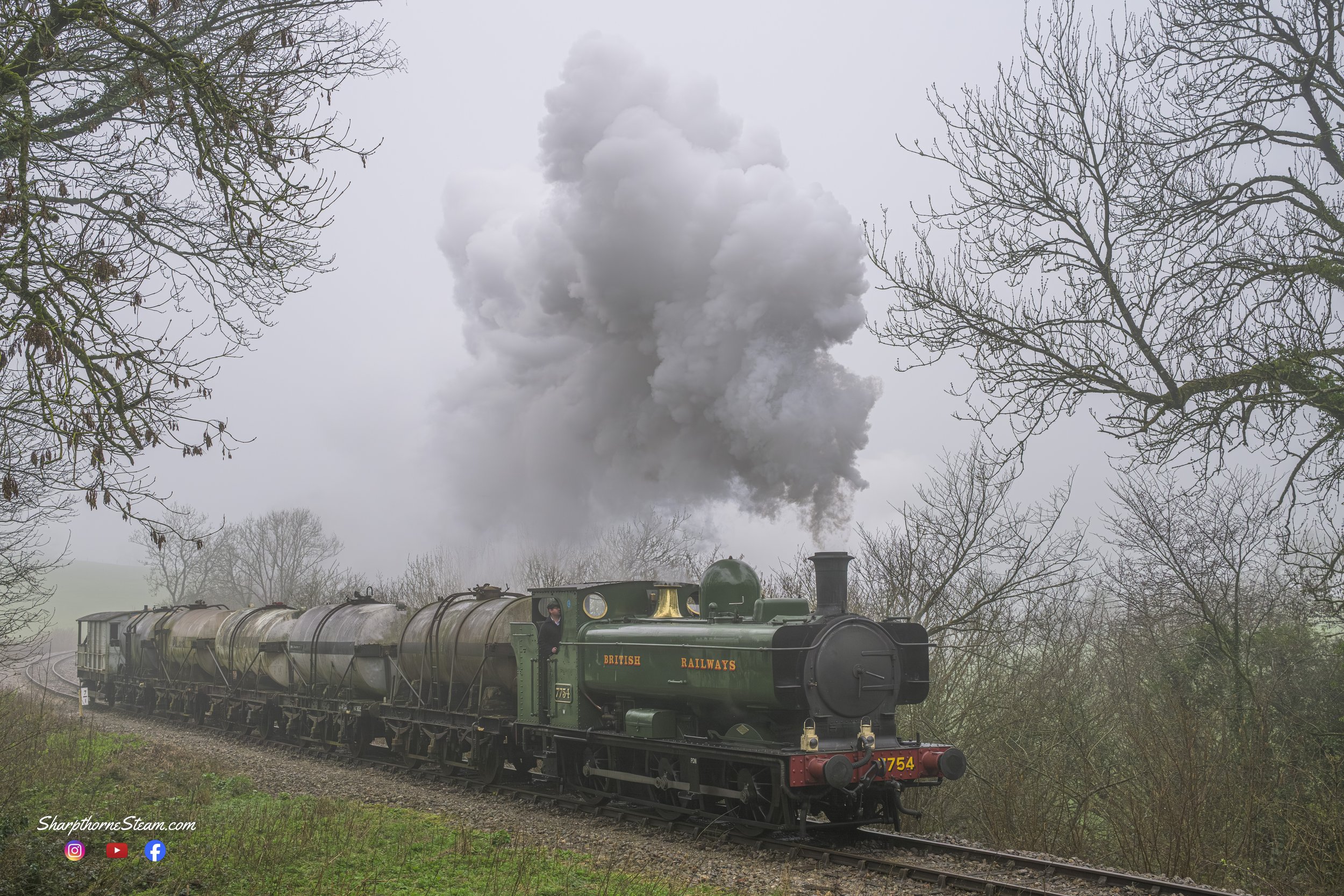 Pannier Power - No7754 powers around the bend out of Mendip Vale with a rake of Milk tanks.