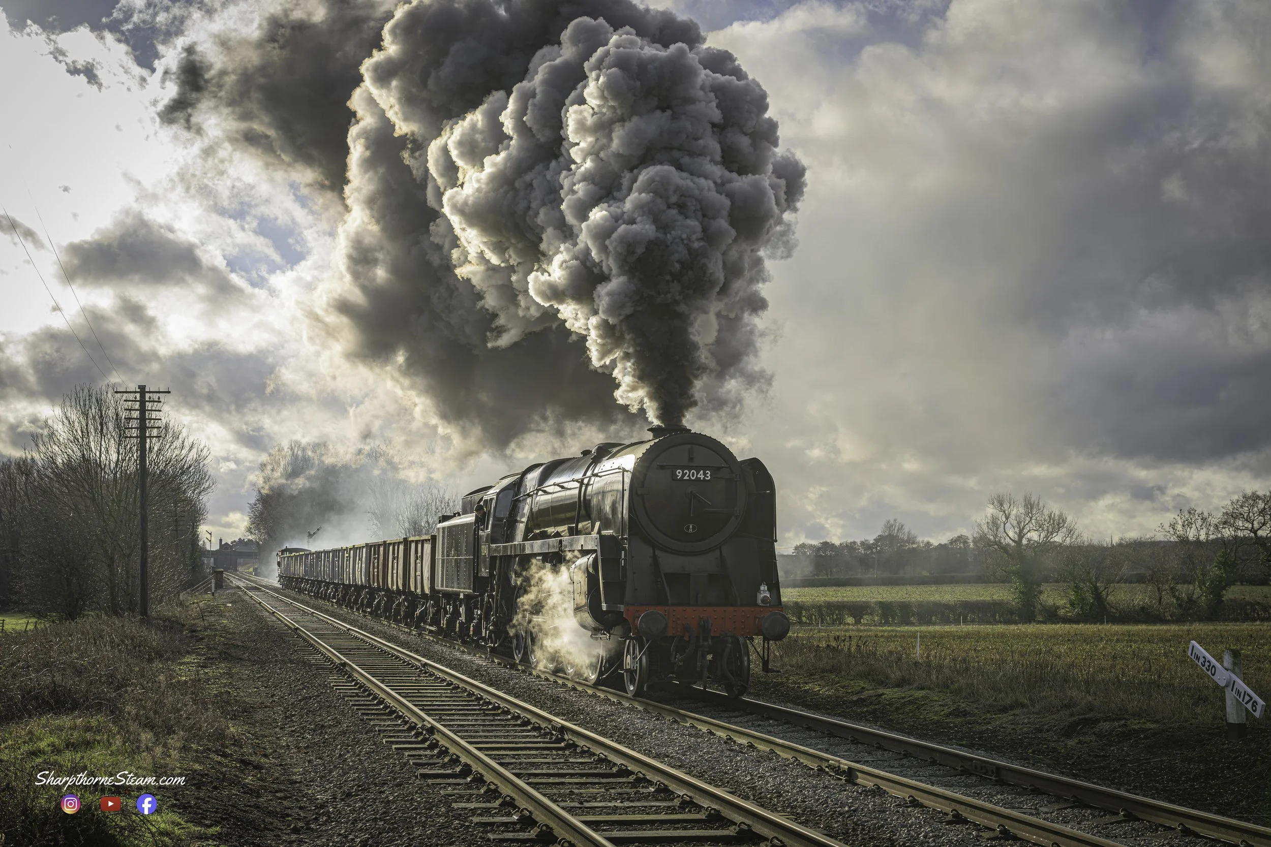 Using the Gradient - No92043 uses the downwards gradient to get a turn of speed on as she departs Quorn