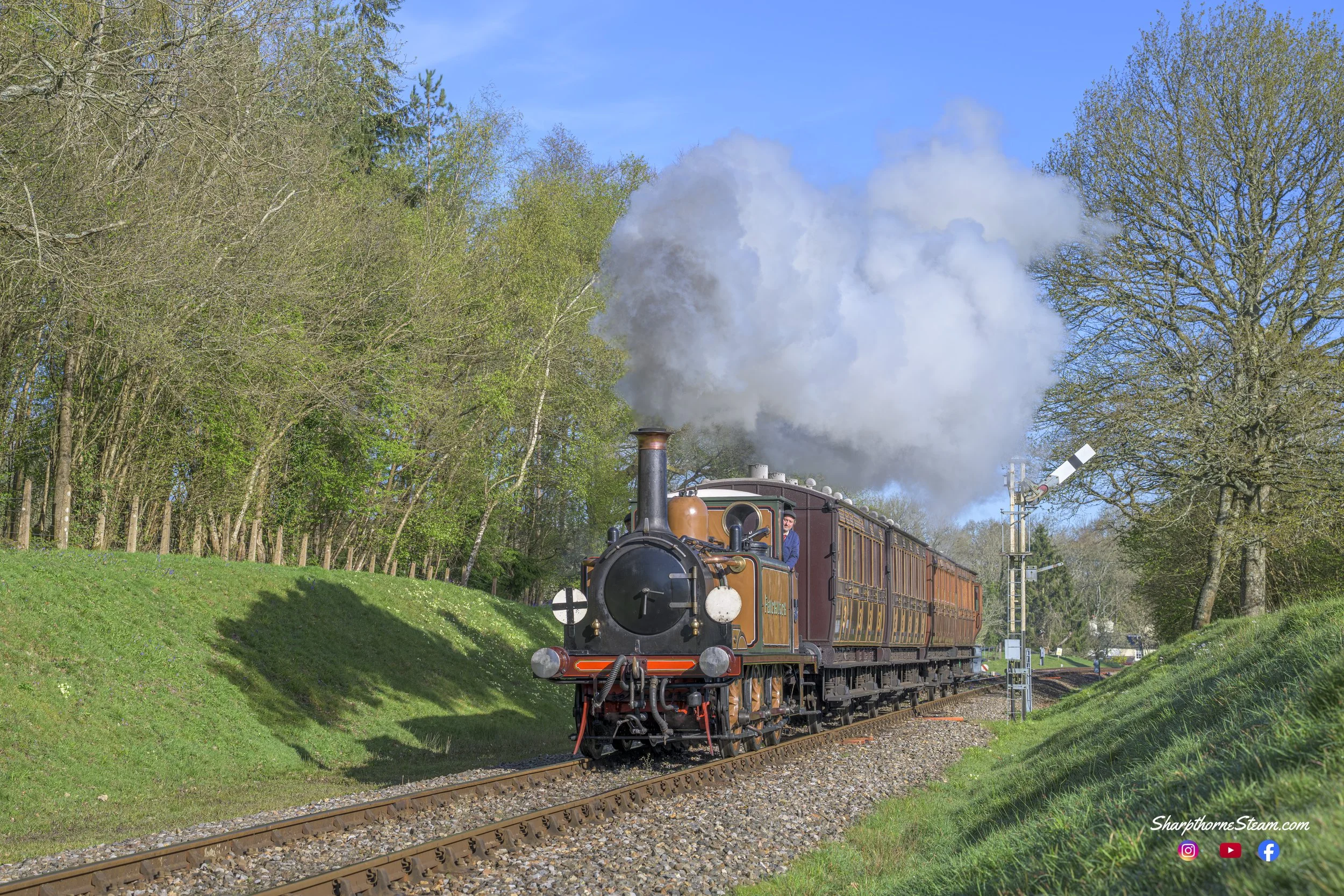 Reflecting South - No72 with her reflection on the bank heads south with her four wheelers.