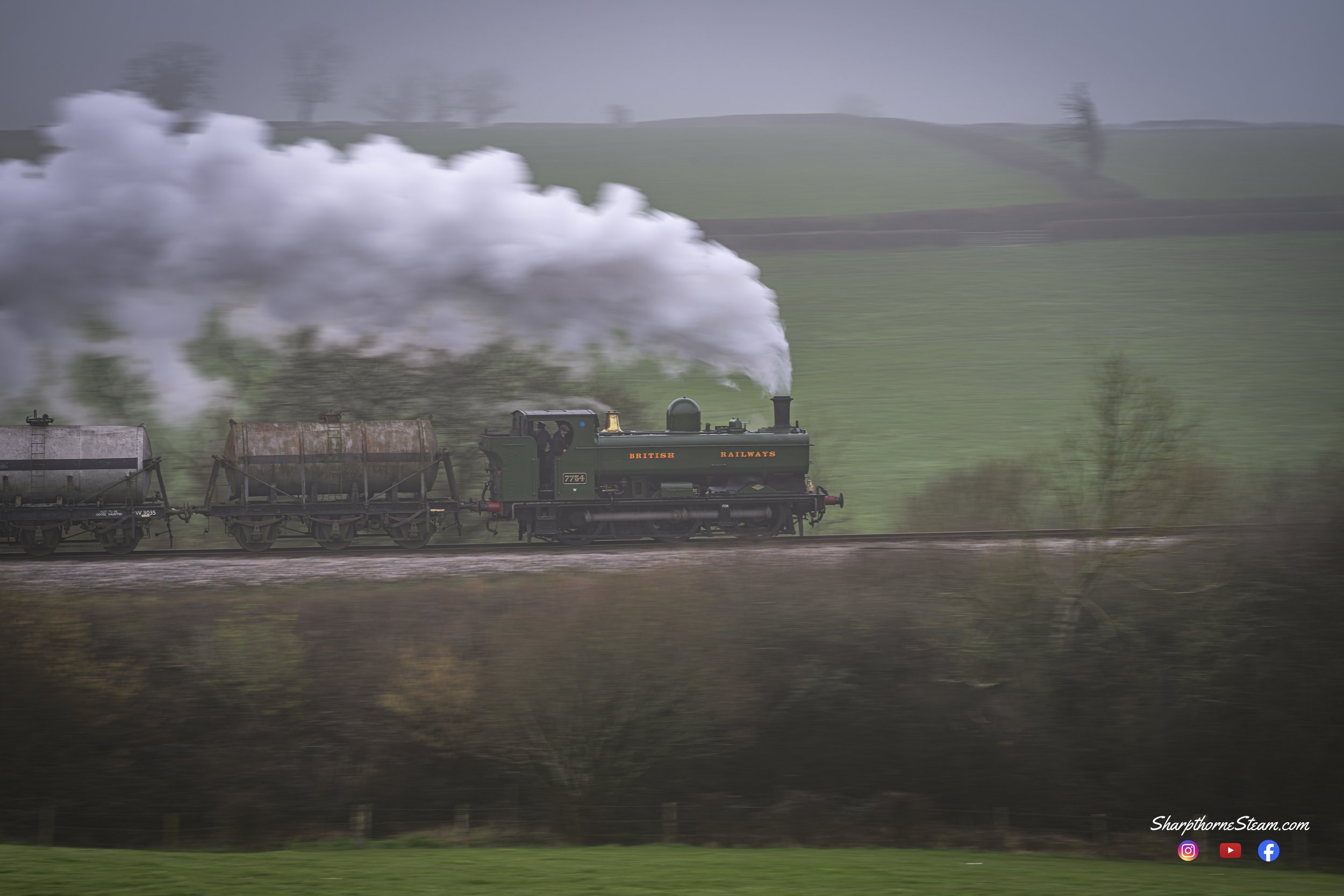HST Pannier - No7754 races past the camera with her goods train