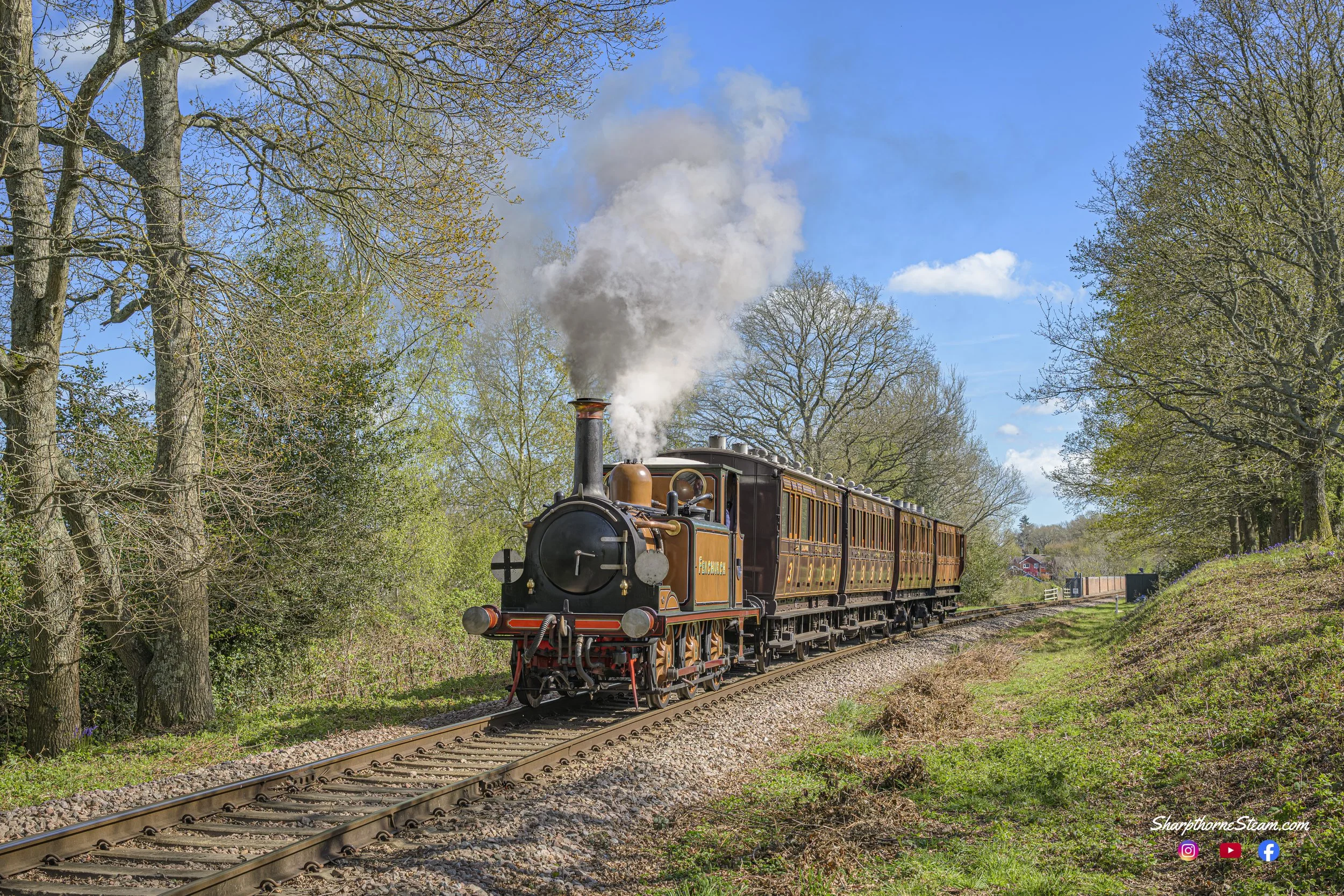 No72 with the four wheelers is seen having just crossed the Viaduct at East Grinstead