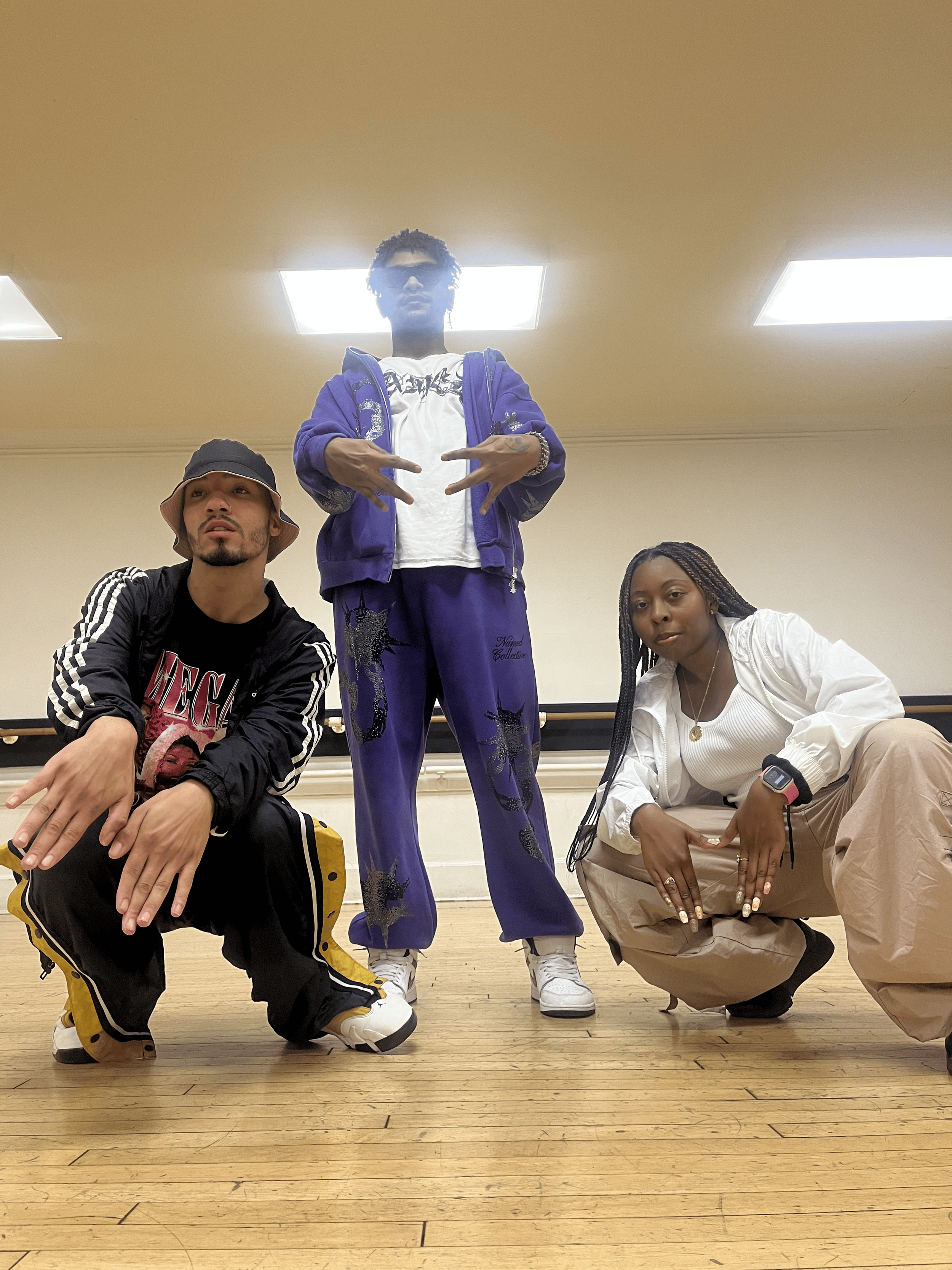 Dance artists from Missy Project pose during a hip-hop and choreography rehearsal focused on collaboration, creativity, and performance. Through community-centered arts programming, Maribel Flores and Missy Project support emerging performers, moveme