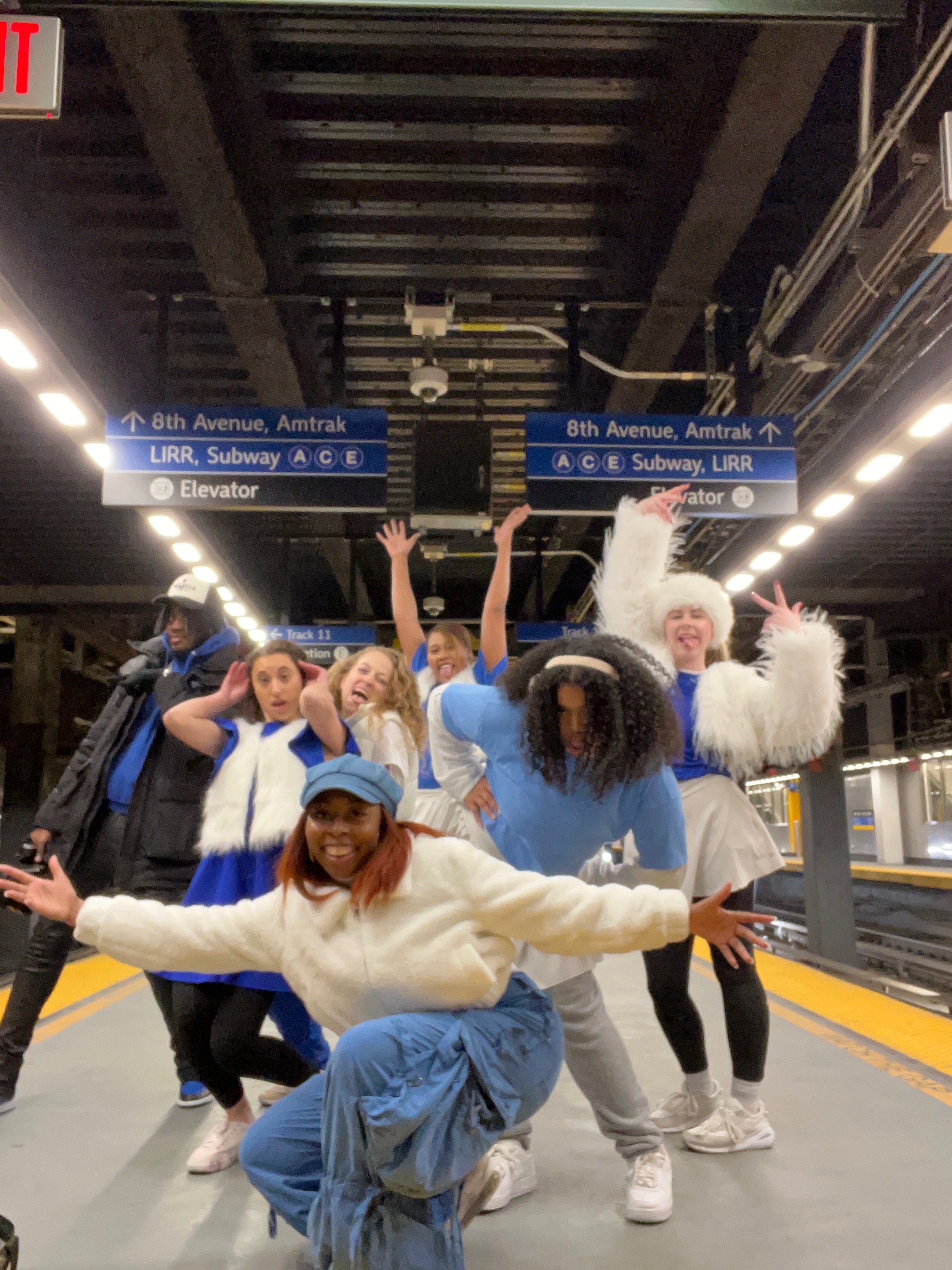 Young performers and teaching artists of The Missy Project pose together at Penn Station during a performance or arts travel experience in New York City. The program provides students with opportunities for performance, cultural exploration, collabor