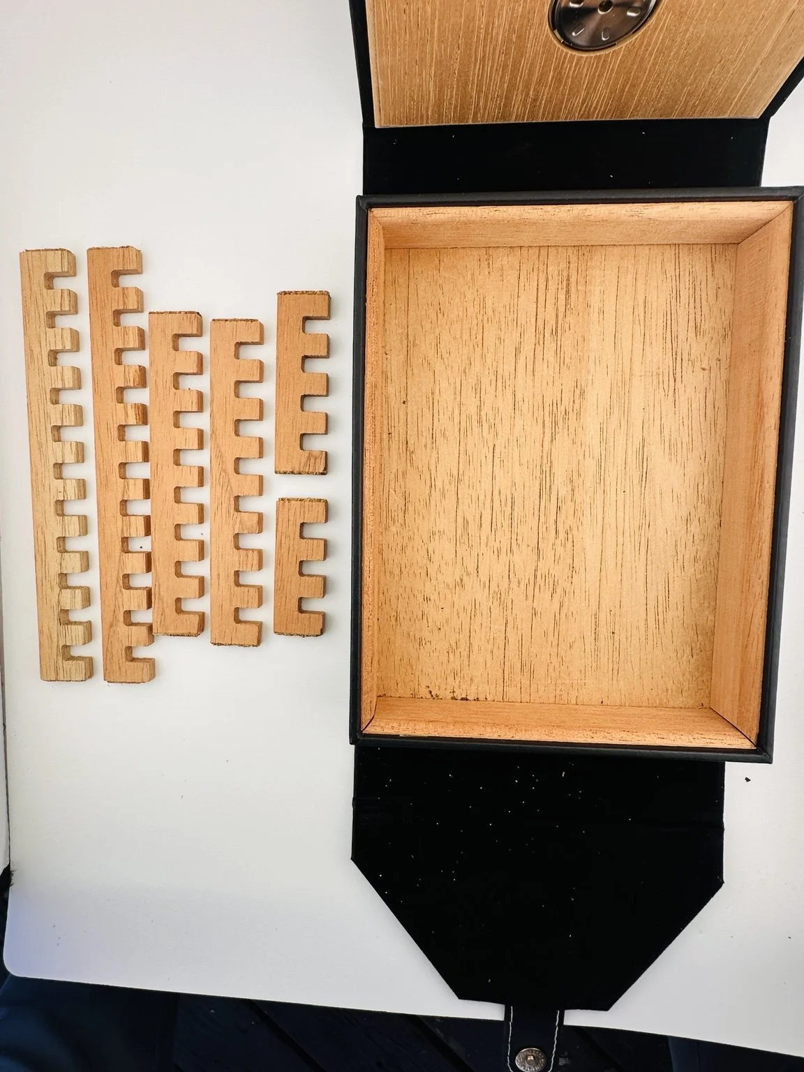 Six removable Spanish cedar divider pieces let you change the interior layout.