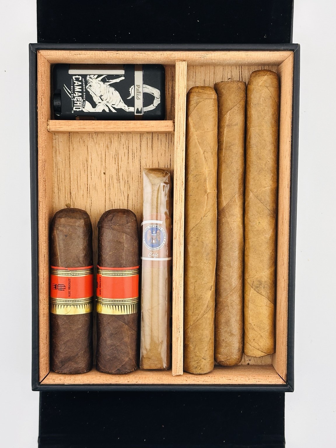 Heritage Box arranged with long and short cigars and a separate cutter compartment.