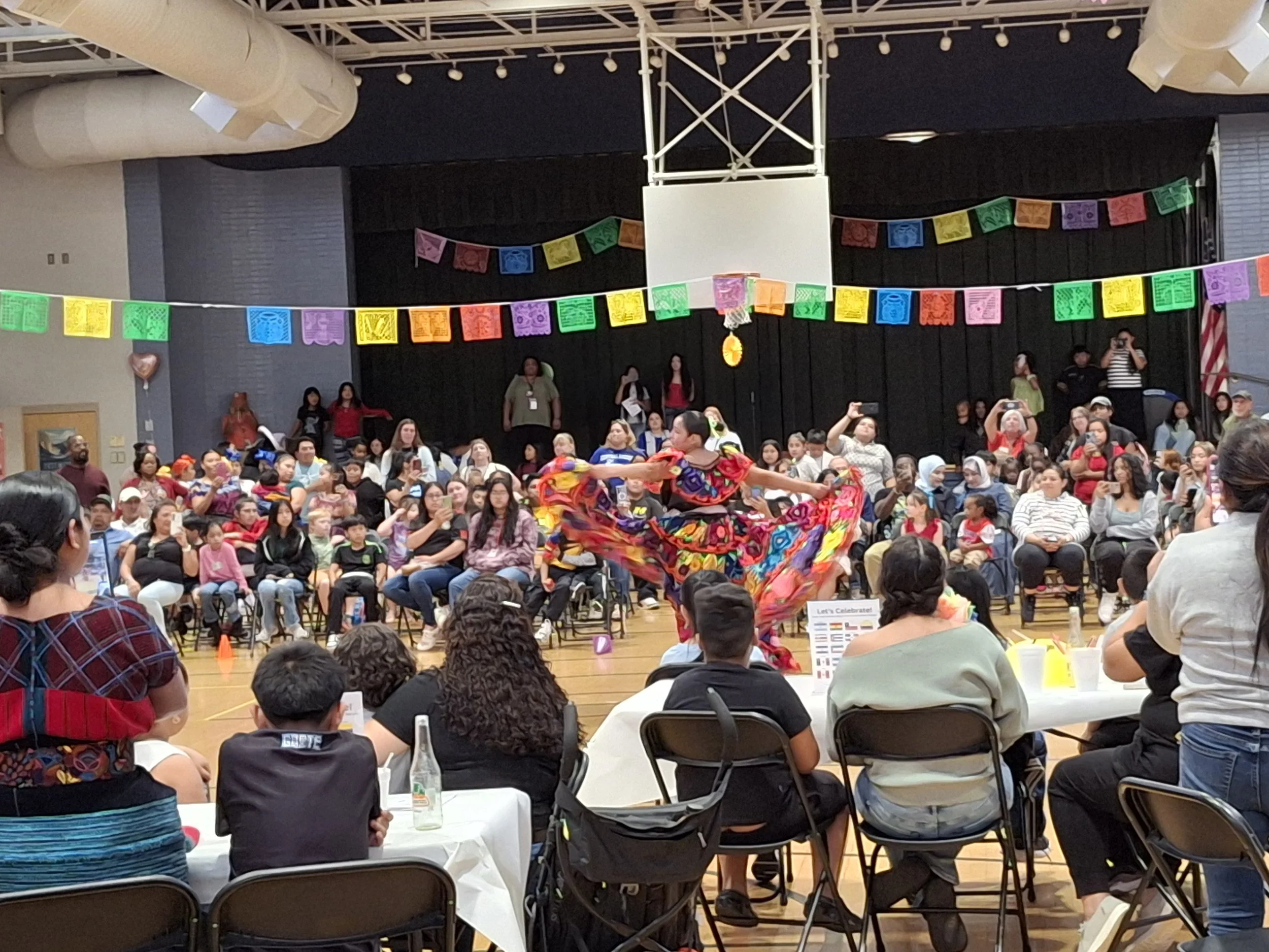 A traditional hispanic dance is performed at Cherrydale Elementary School gymnasium 