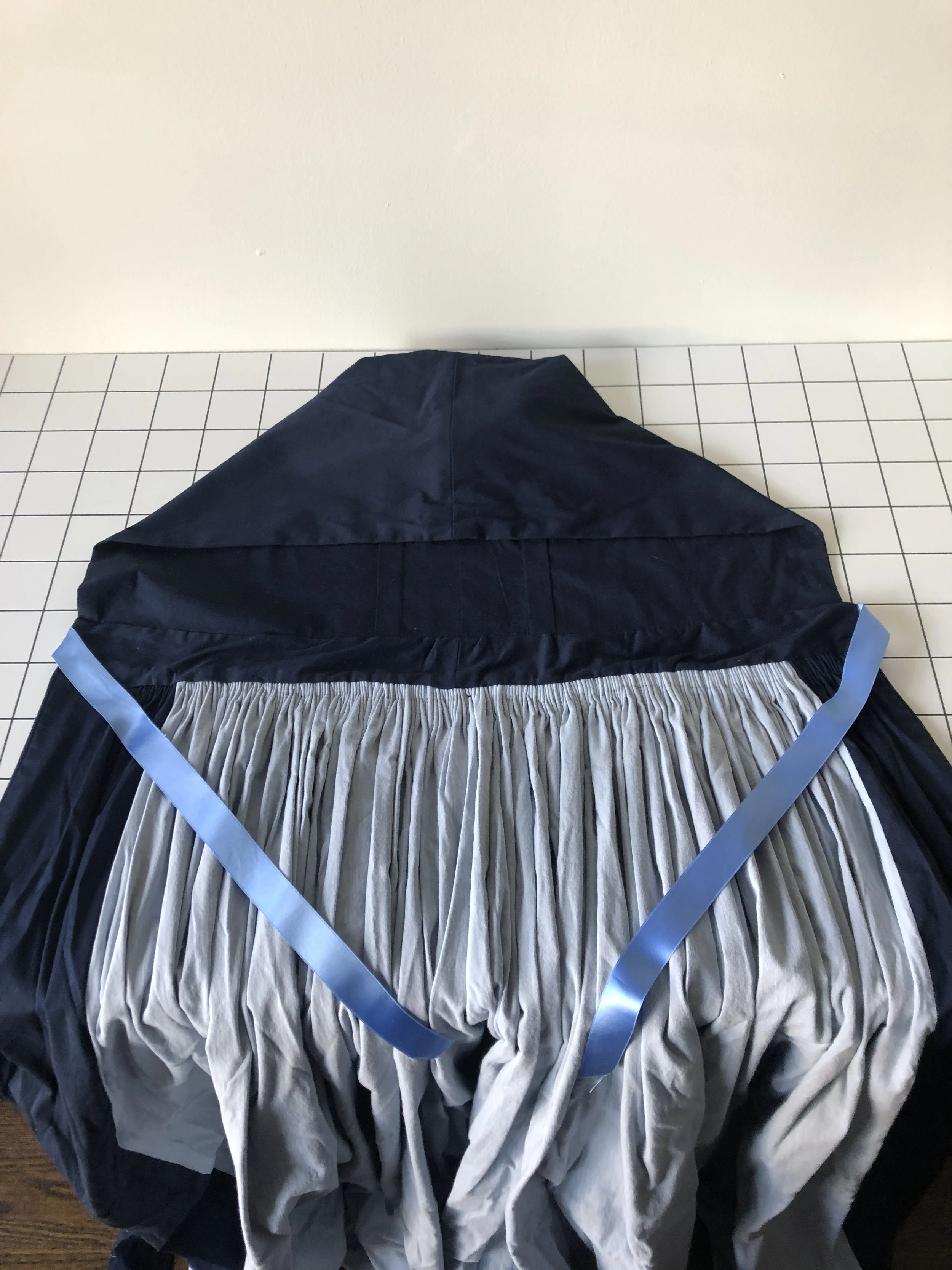 Cartridge pleats inside cloak