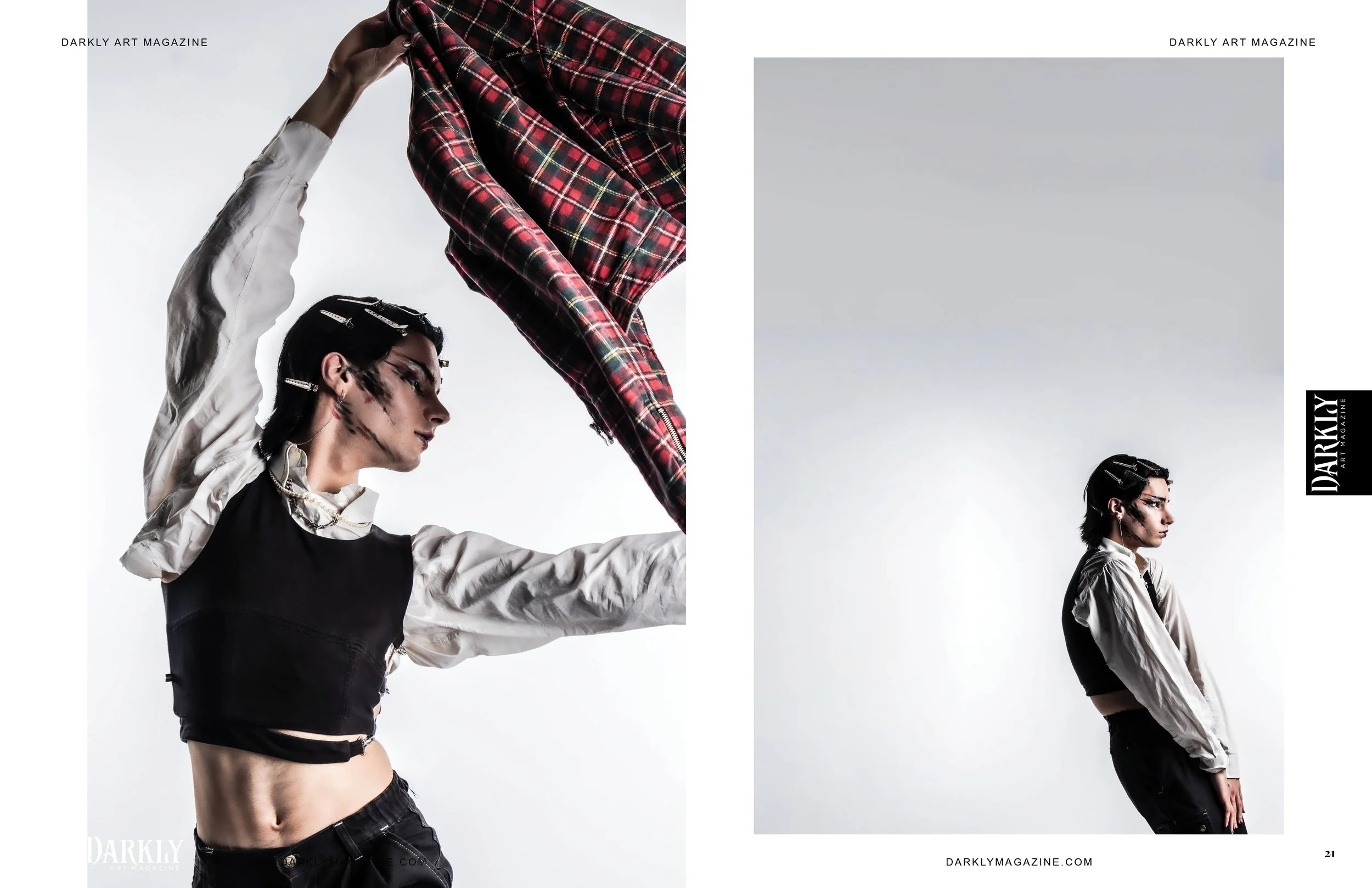 Personne posant avec une chemise à carreaux, fond blanc, stylisme avant-gardiste, apparaissant dans Darkly Art Magazine.