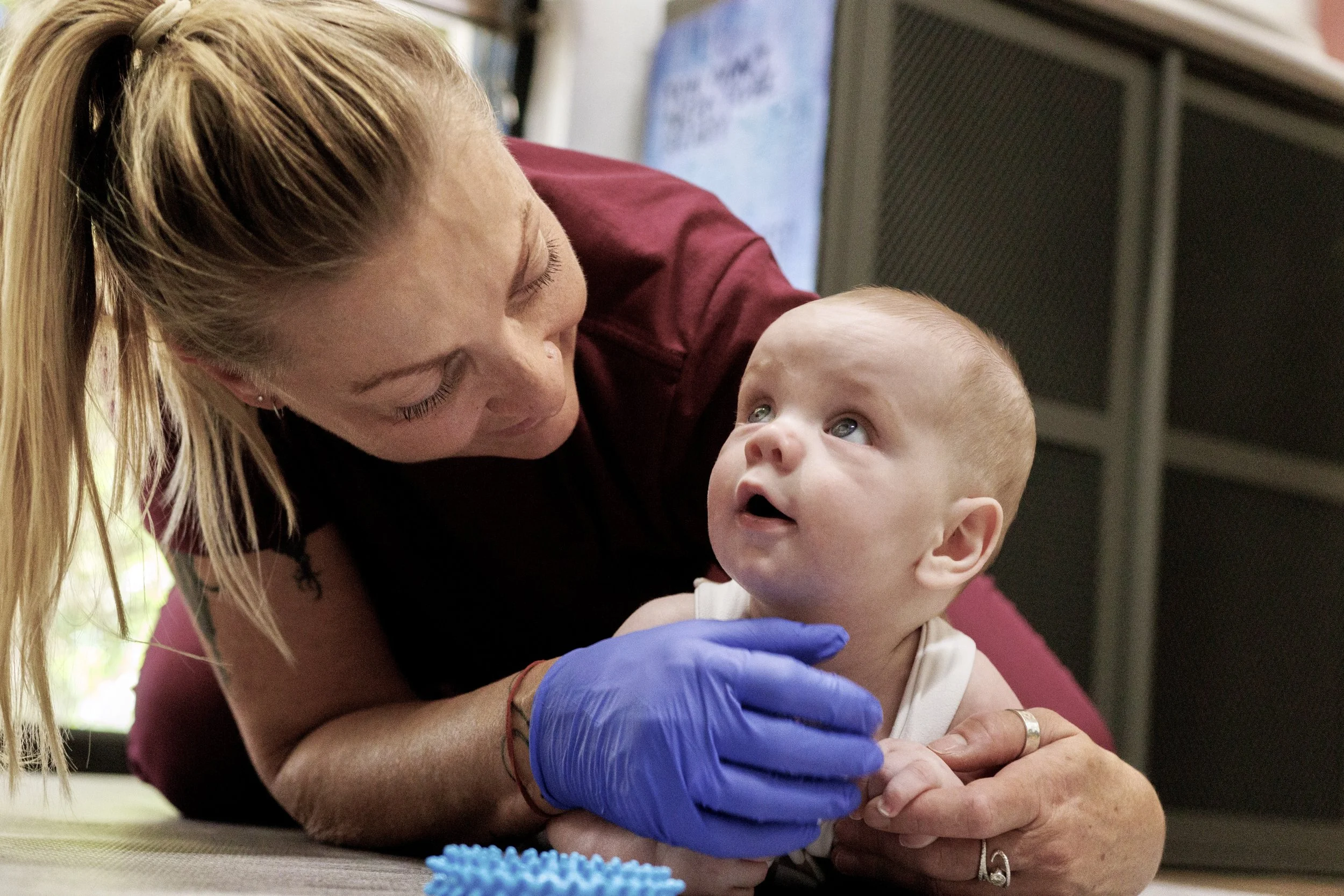 Trine Bradshaw, IBCLC helping one of her clients to get better at Tummy Time
