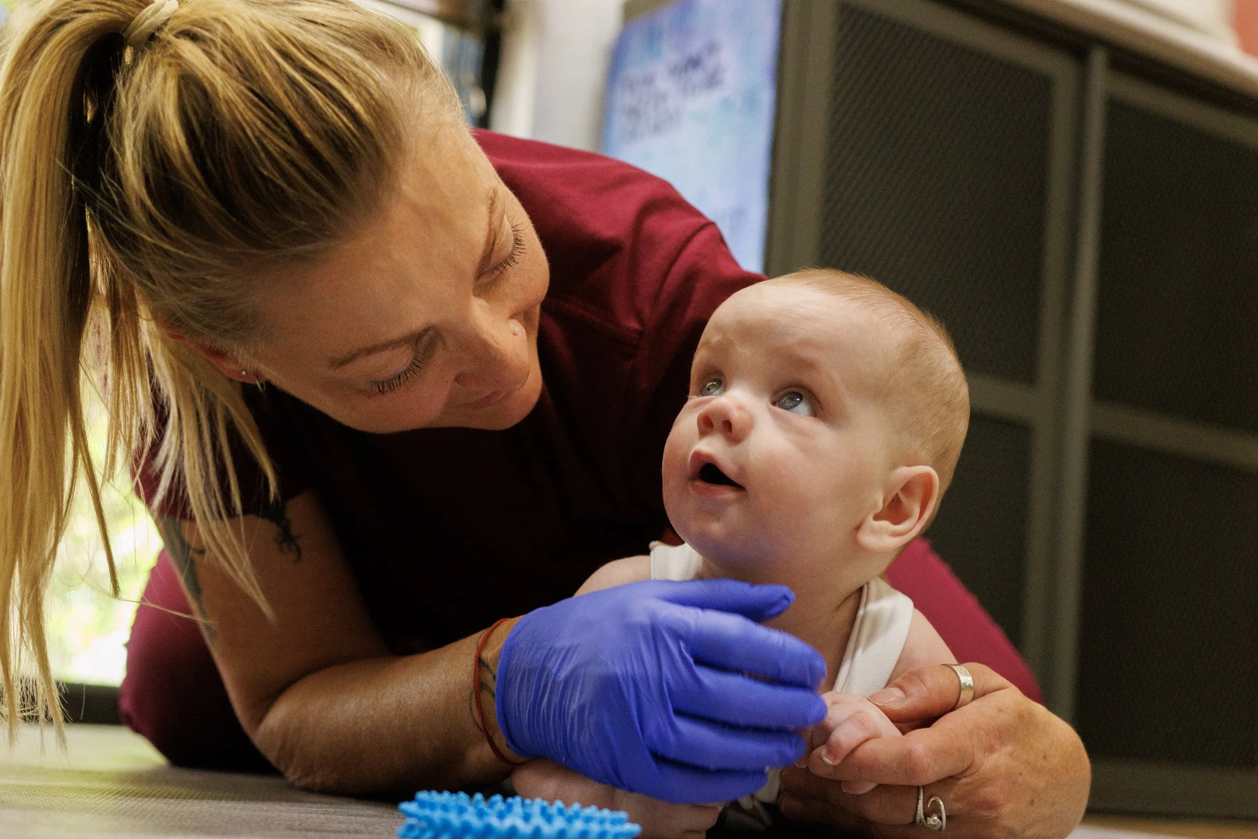 Trine Bradshaw, IBCLC during assessment with baby