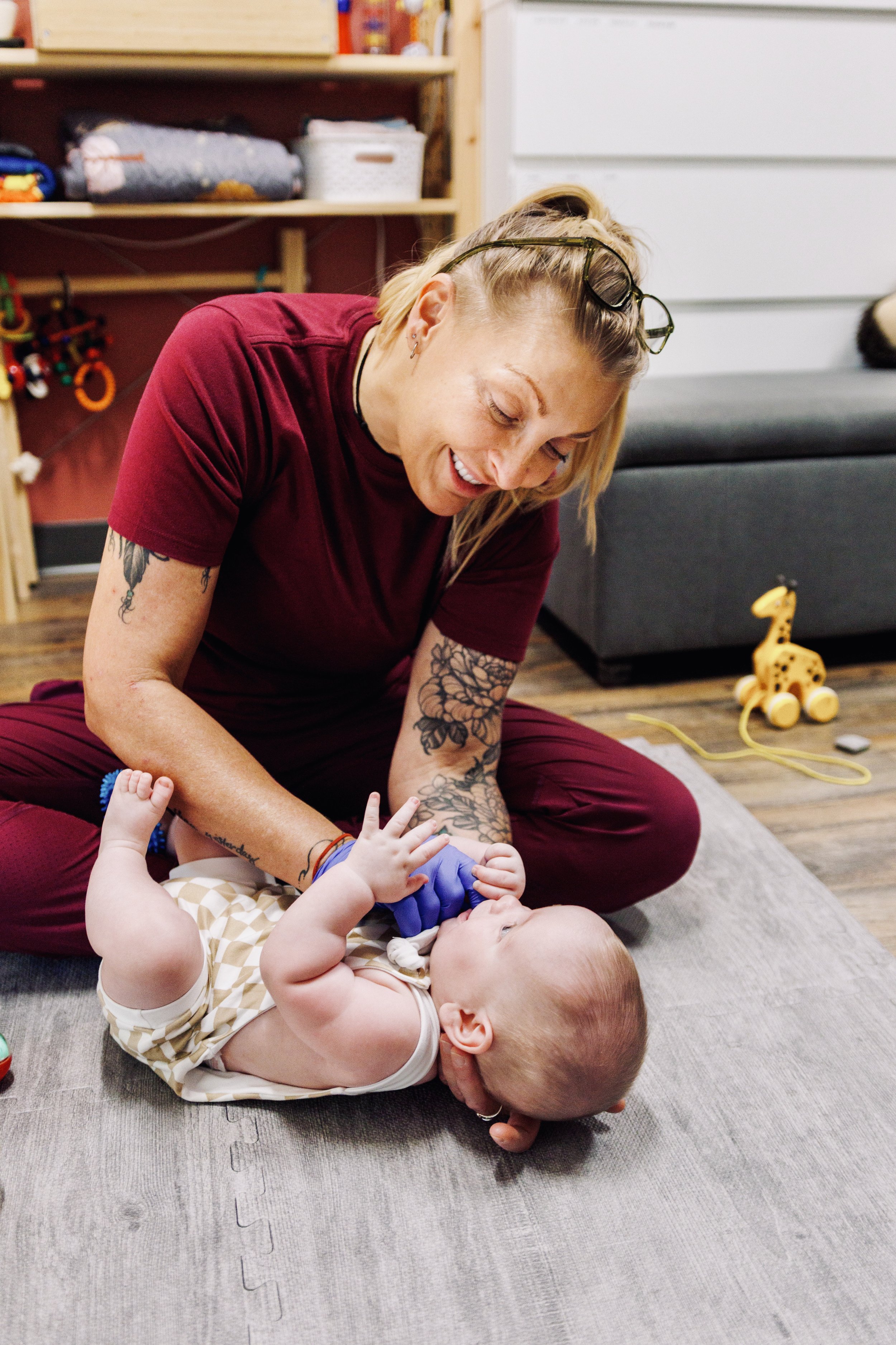 Trine Bradshaw, IBCLC doing an infant oral skills assessment