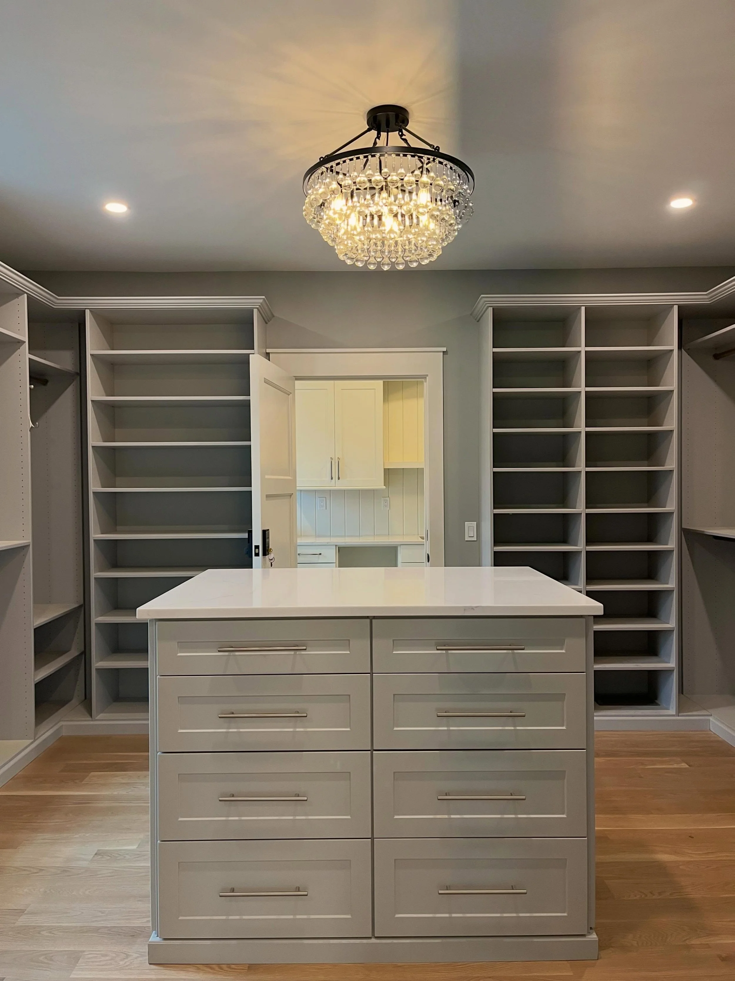 A closet designed to feel more like a boutique than a storage space. Custom built-ins, soft layered tones, and a statement chandelier bringing a little luxury into the everyday routine. ✨

Builder: @neillbros 
Architect: @dimauroarchitects 

#CustomC