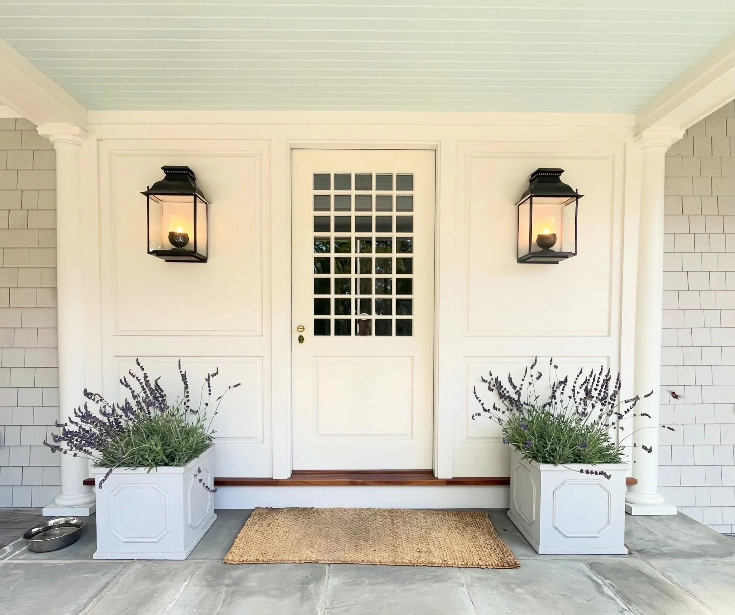 Spring is in the air. 🌿🪺

This front entry was designed to feel timeless from the very first step in. A custom 40-lite &frac34; glass entry door, handcrafted alongside the surrounding paneling by a local boat builder, brings a level of craftsmanshi