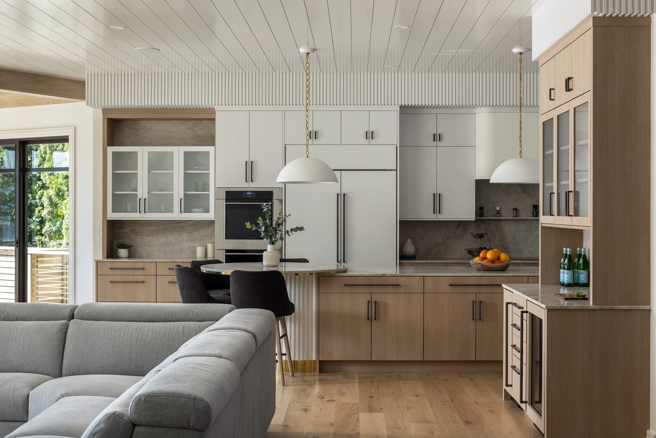 Hundred Acre Pond, South Kingstown, Construction, Builders, Neill Brothers, white kitchen with wood tone island and built in cabinets, white pendant lights