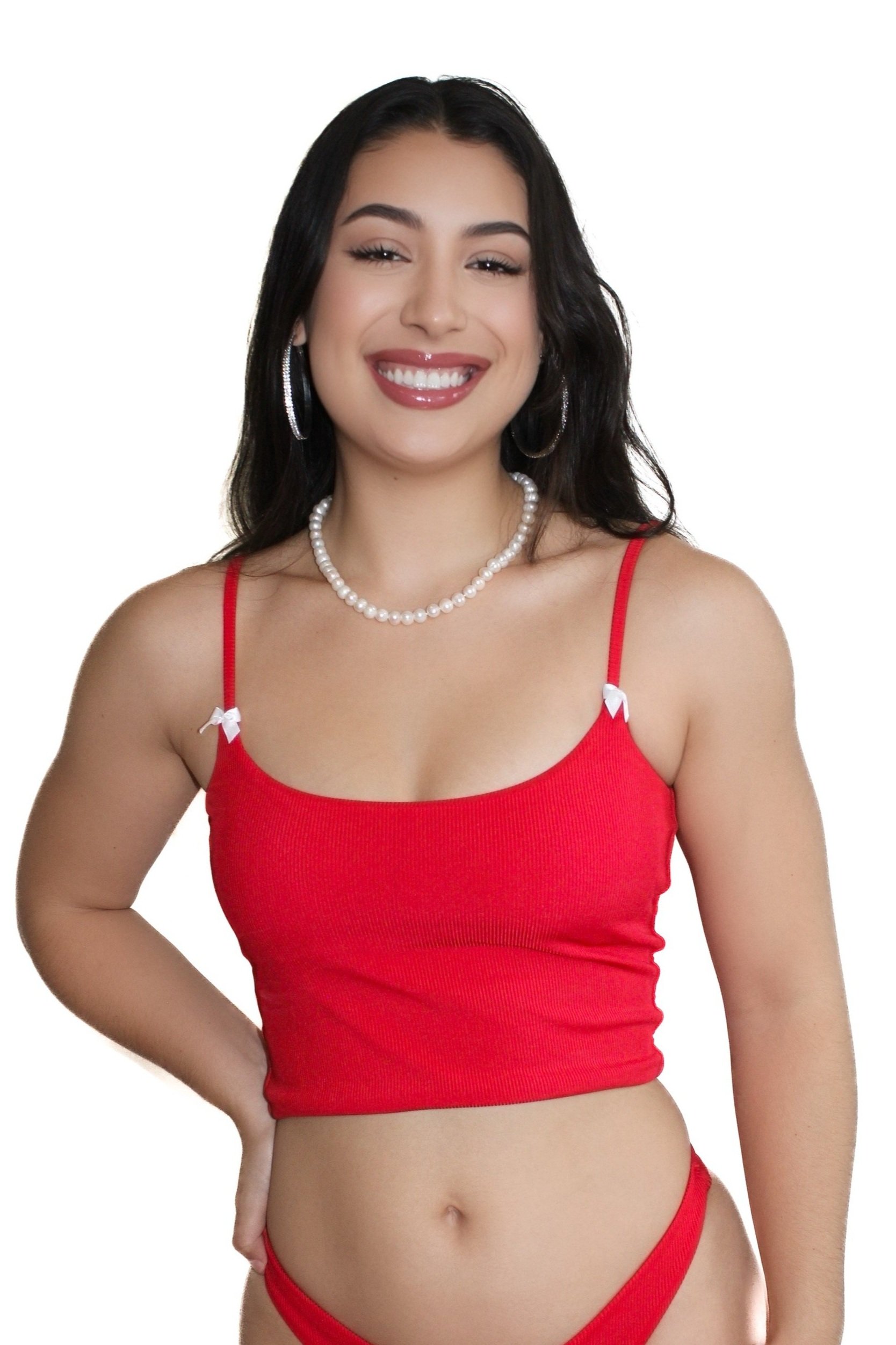 Model wearing Meena Swims Cherry on Top tankini top in red ribbed fabric, flirty vintage style