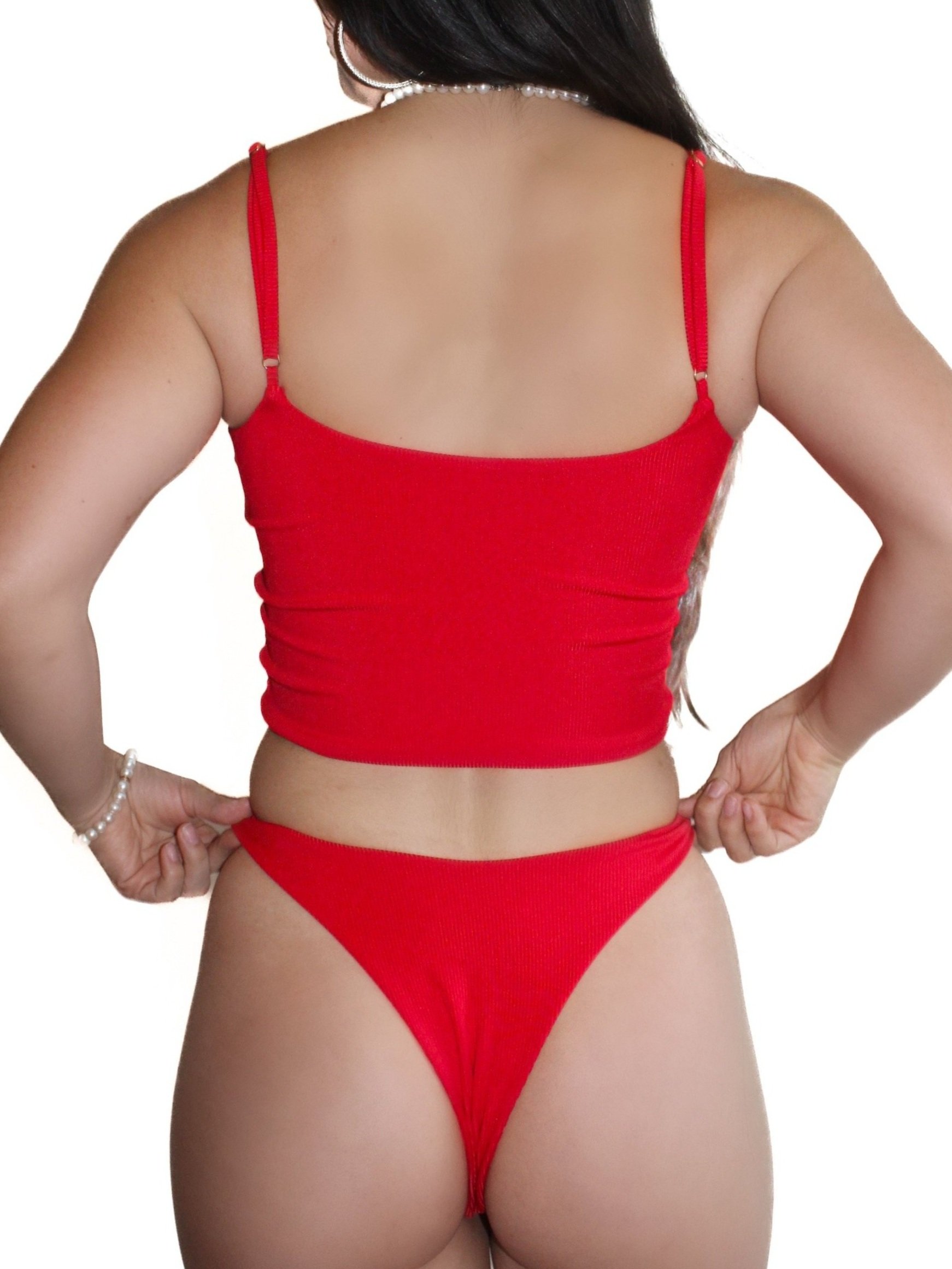 Back view of Meena Swims Cherry on Top Bottoms, red ribbed fabric with flattering high-cut fit