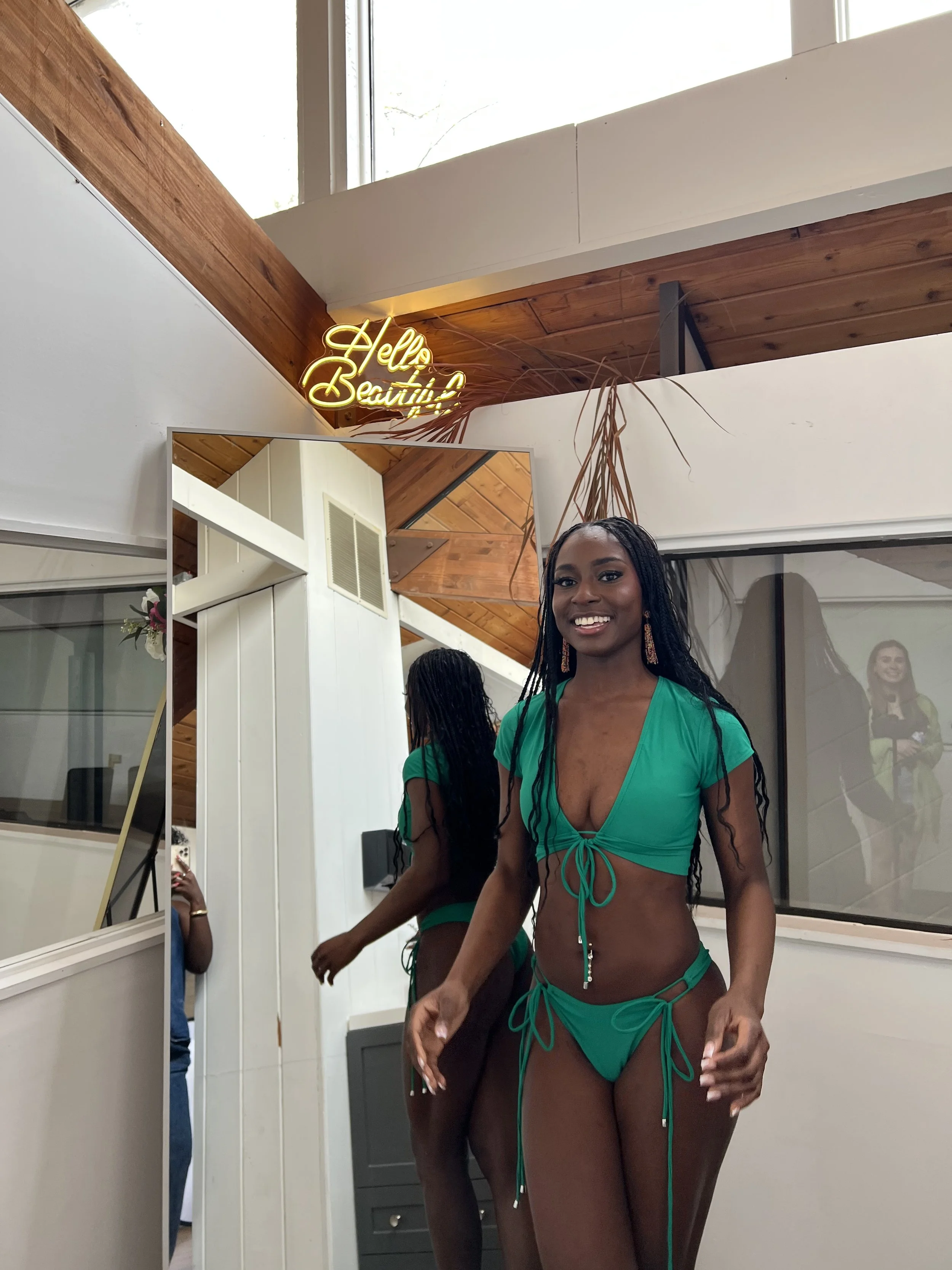 Model wearing green string bikini showing side fit and adjustable ties. Meena Swims size reference highlights flexible sizing, adjustable swimwear, and how bottoms sit on the hips for a true to size fit.