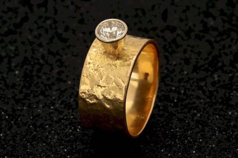 Reticulated Gold Diamond Ring
This striking 18K gold band showcases a unique reticulated texture, achieved through an intricate heating and oxidation process repeated over 20 times. The result is a beautifully organic, wrinkled surface that adds dept