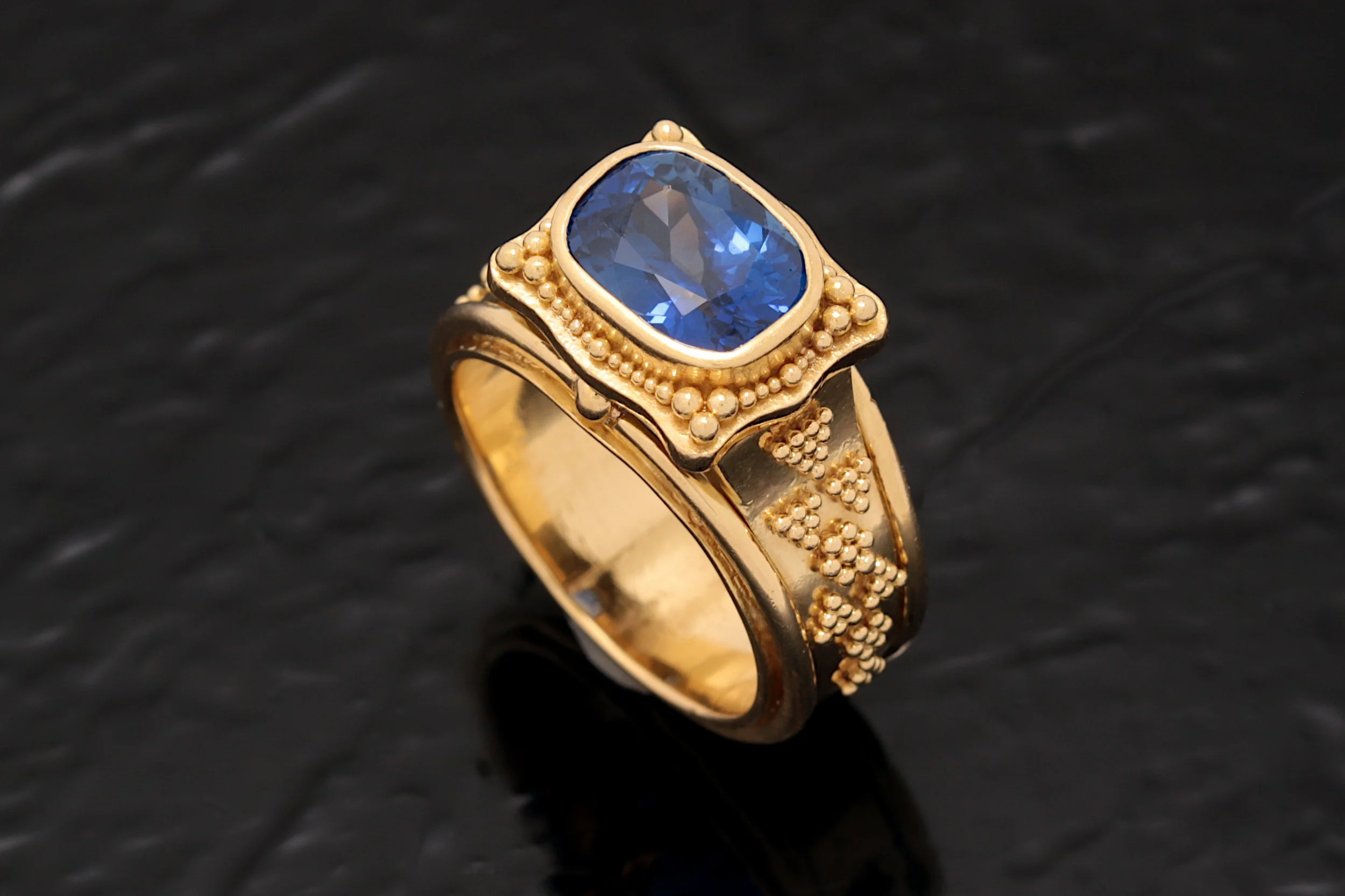 Handcrafted Granulated Sapphire Ring
Inspired by antique and period jewelry, this entirely handmade ring is a masterpiece of granulation, crafted without solder. The design showcases a platform-style setting that highlights a rare, untreated 3.68-car