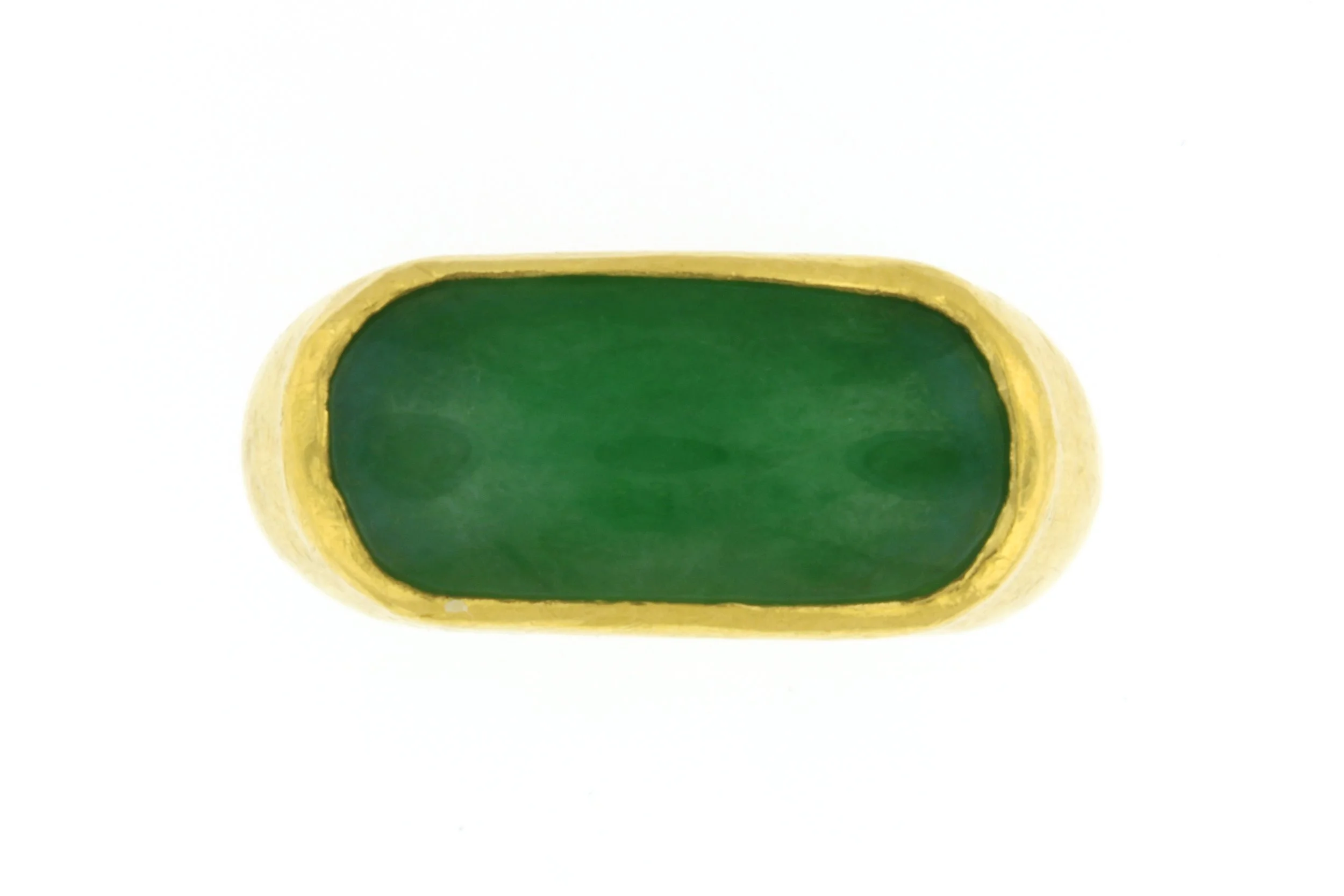 24K Gold Burmese Jadeite Saddle Ring
Commissioned for a collector of fine gems, this ring features an extraordinary untreated Burmese jadeite, expertly shaped into a smooth saddle form. The setting, executed entirely in pure 24K gold, enhances the ja