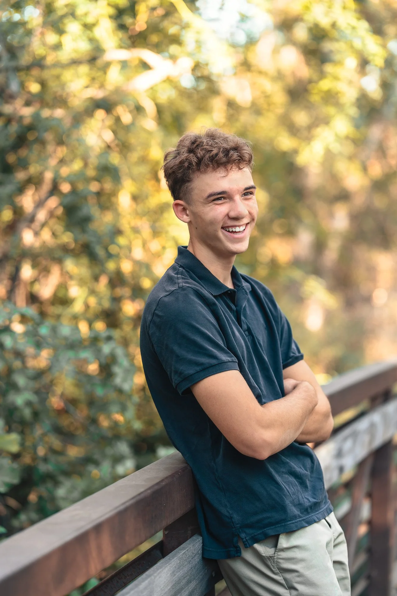 Boise greenbelt senior photoshoot against the bridge 