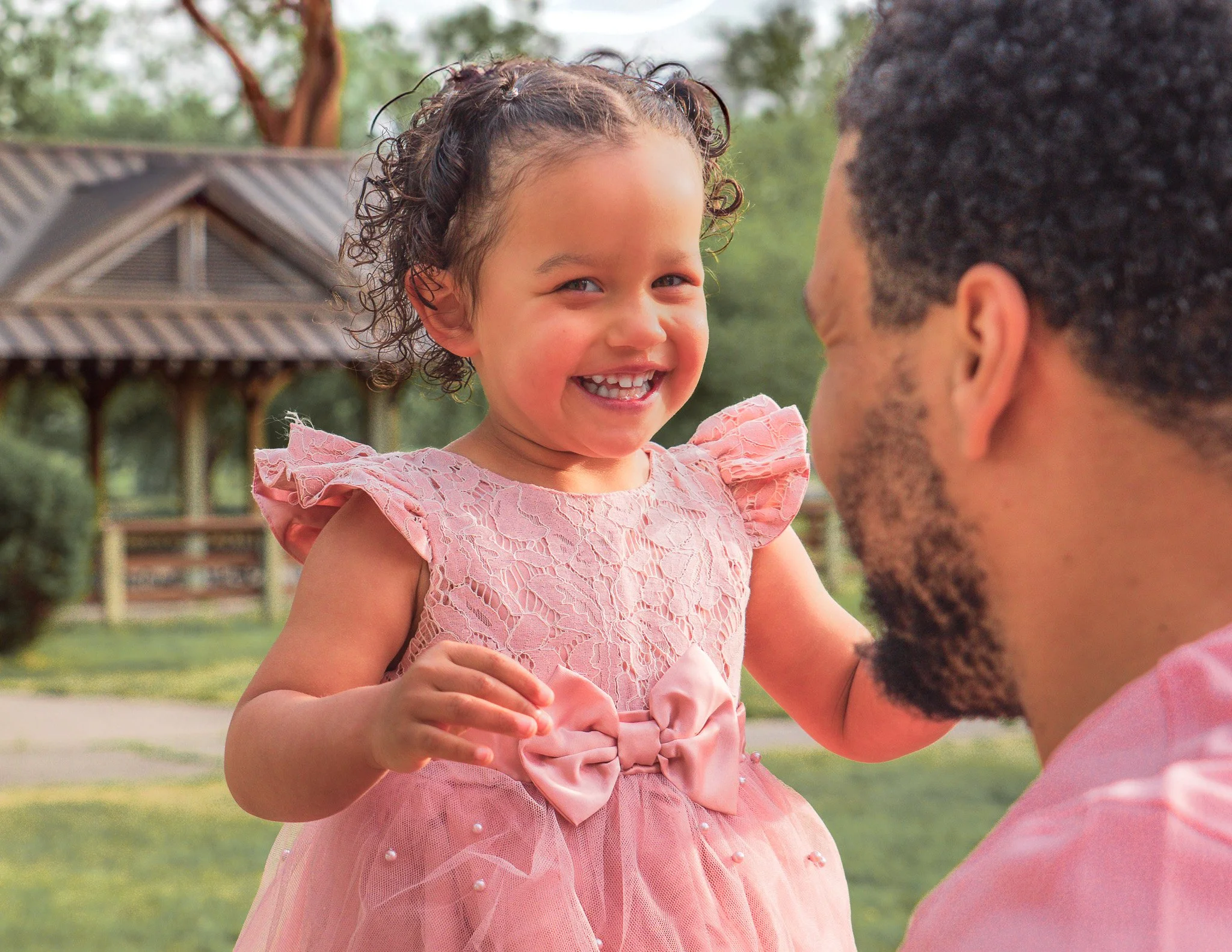 Joyful daddy-daughter moment captured in a Boise park during a family photo session. This image radiates warmth, laughter, and genuine connection—perfectly showcasing the natural beauty of lifestyle photography for families in Boise, Meridian, Eagle,
