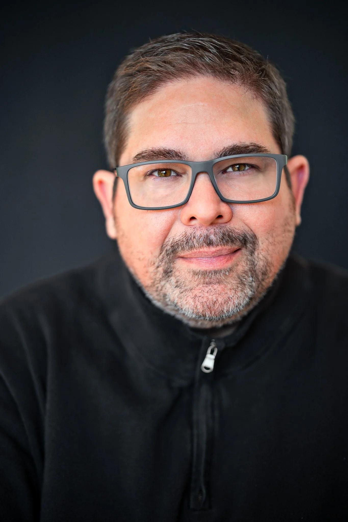 Man in black shirt professional headshot using natural light Eagle Idaho studio session.