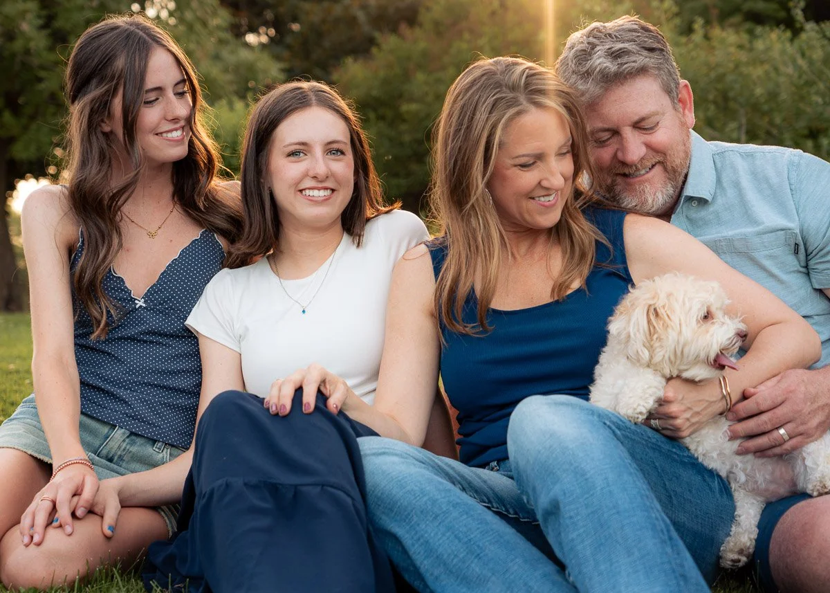 Candid picture of family of four with their dog in Boise, Idaho. golden evening light. Candid and connected lifestyle photography for families in Meridian, Eagle, Star, Boise, and the Treasure Valley.