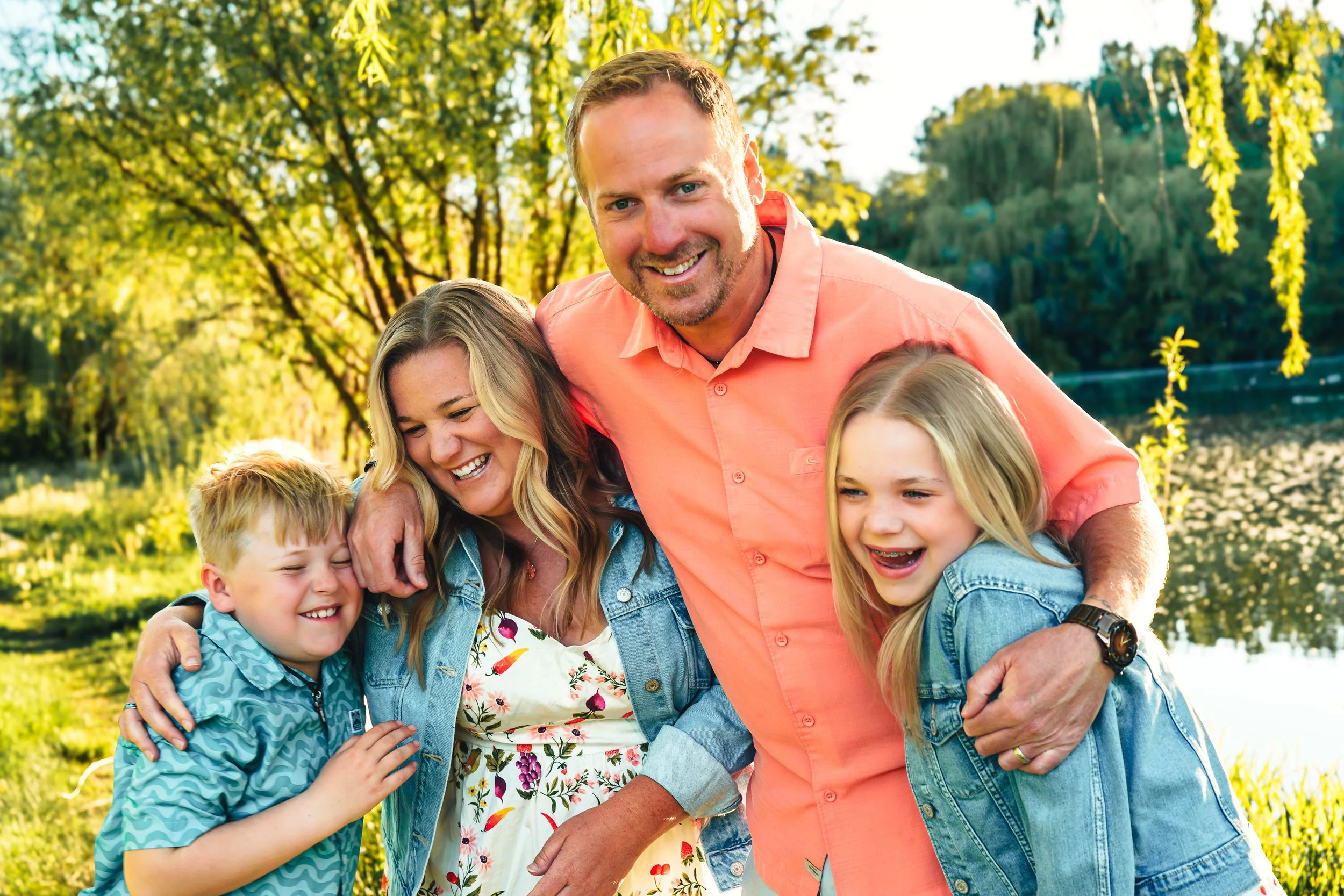 Candid backyard family photo session in Eagle, Idaho featuring joyful expressions and golden evening light. Lifestyle family photography that feels relaxed, connected, and real — serving families in Eagle, Boise, Meridian, Star, and the Treasure Vall