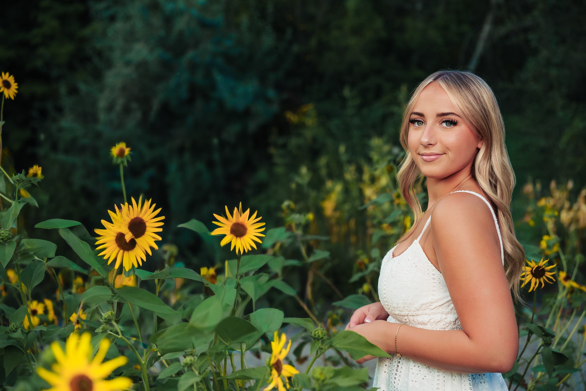 Beautiful senior session in Eagle Idaho. Sunflowers with a beautiful backdrop. Senior in all white. Treasure Valley, Boise, Eagle, Meridian, Nampa.