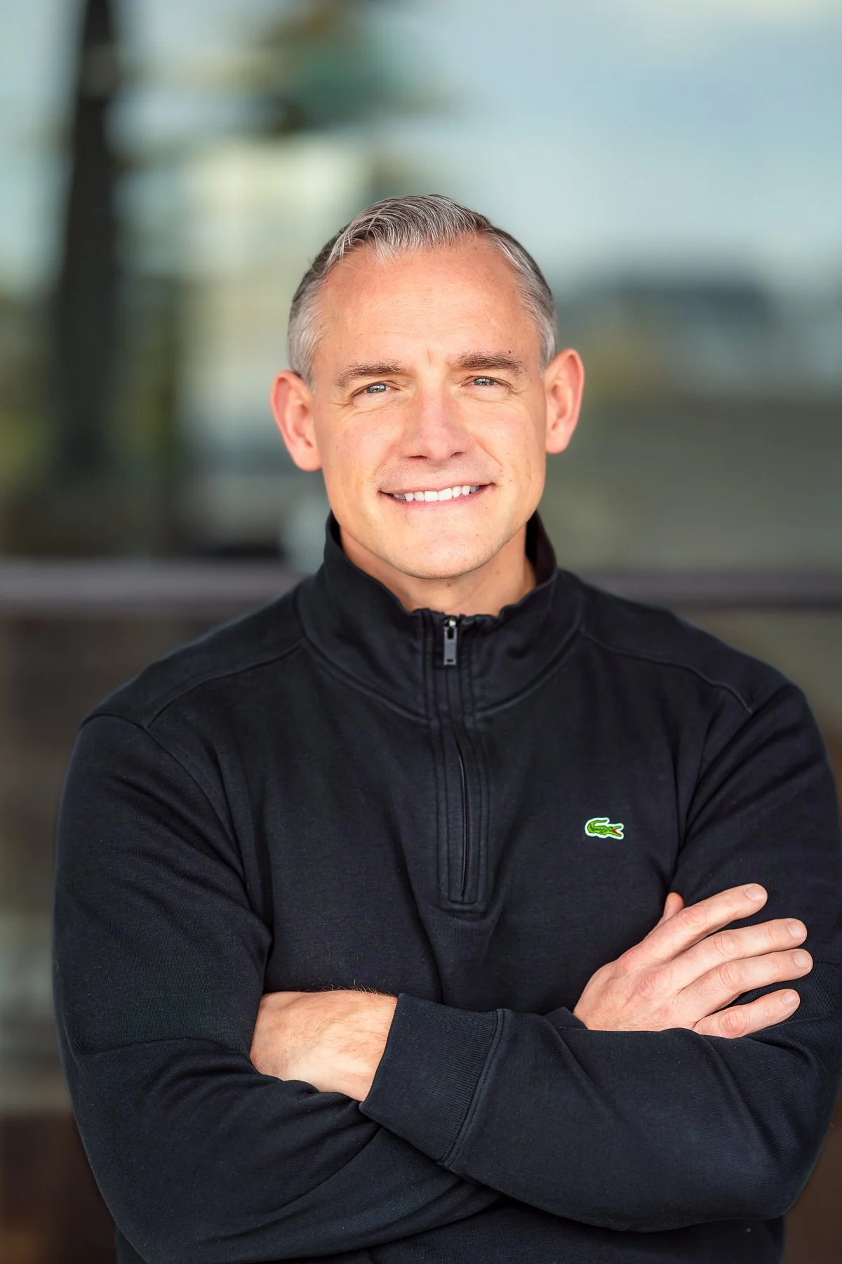Male real estate agent outdoor headshot with natural light in Boise Idaho