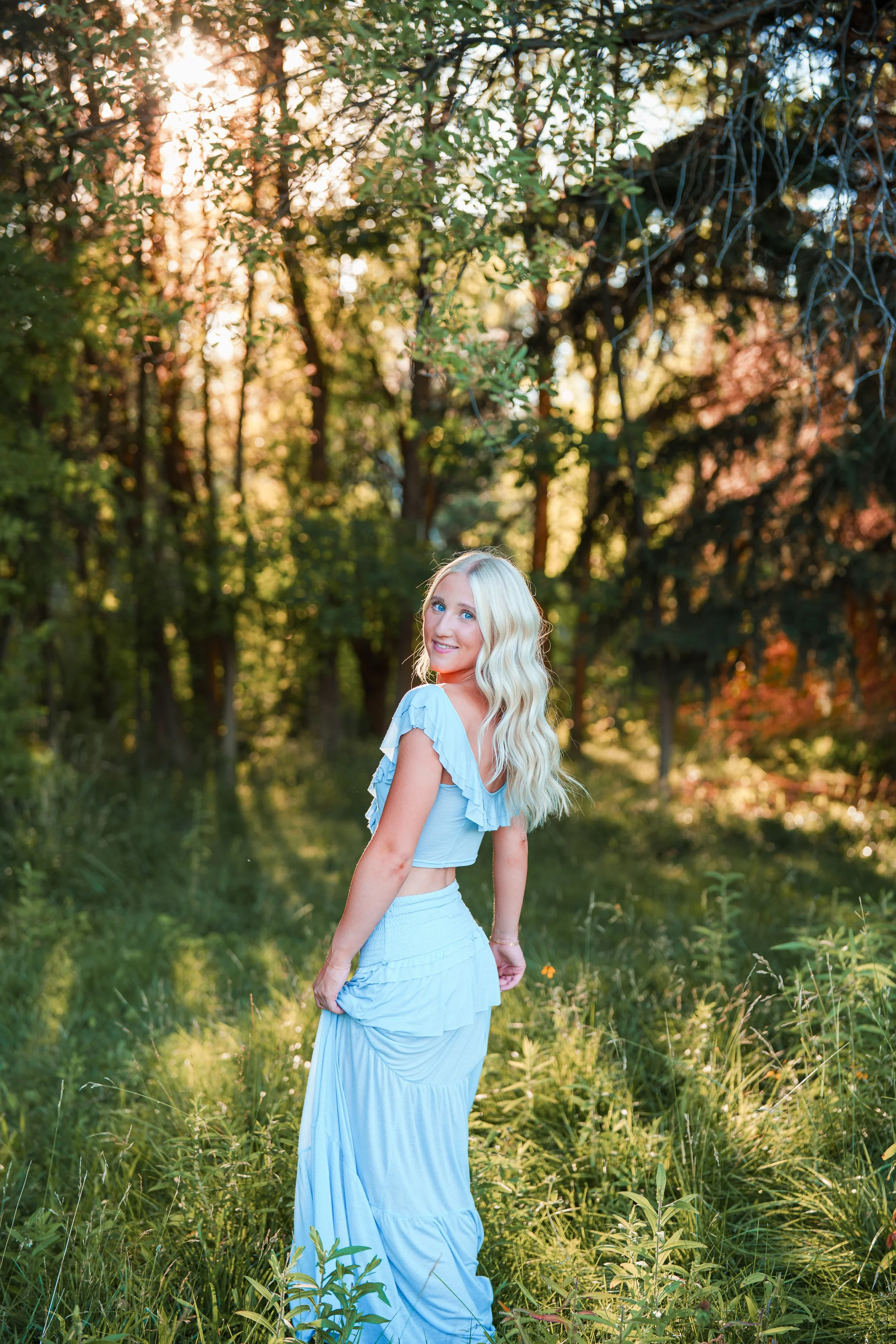 Beautiful golden hour at Kathryn Albertson Park. Blue long dress with blonde hair