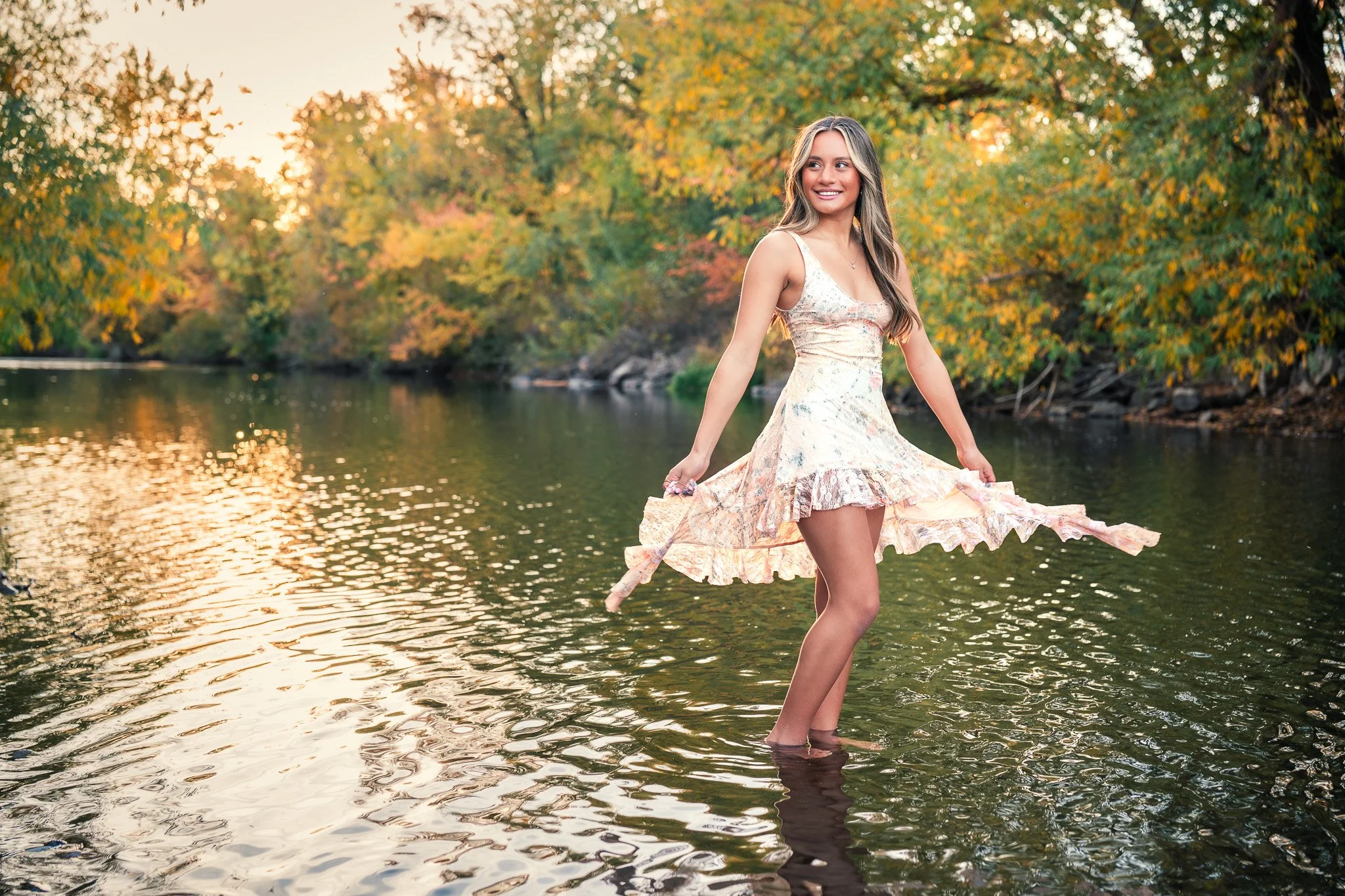 Golden light and calm water create the perfect backdrop for this senior session in Eagle, Idaho. Capturing confidence and natural beauty is what makes senior photography in the Treasure Valley so special. Merril Park Eagle Idaho
