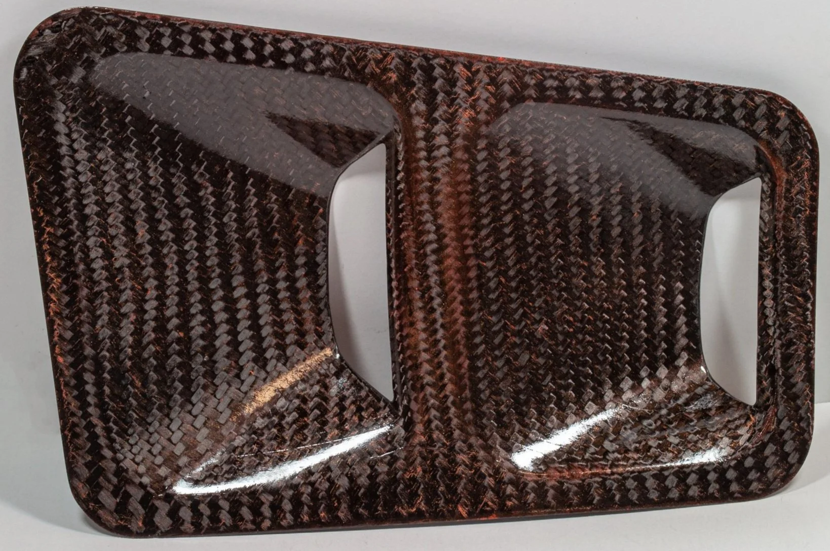 Shape influenced by the hood skeleton for ease of installation. Coated in a high strength clear coat to protect against UV degradation